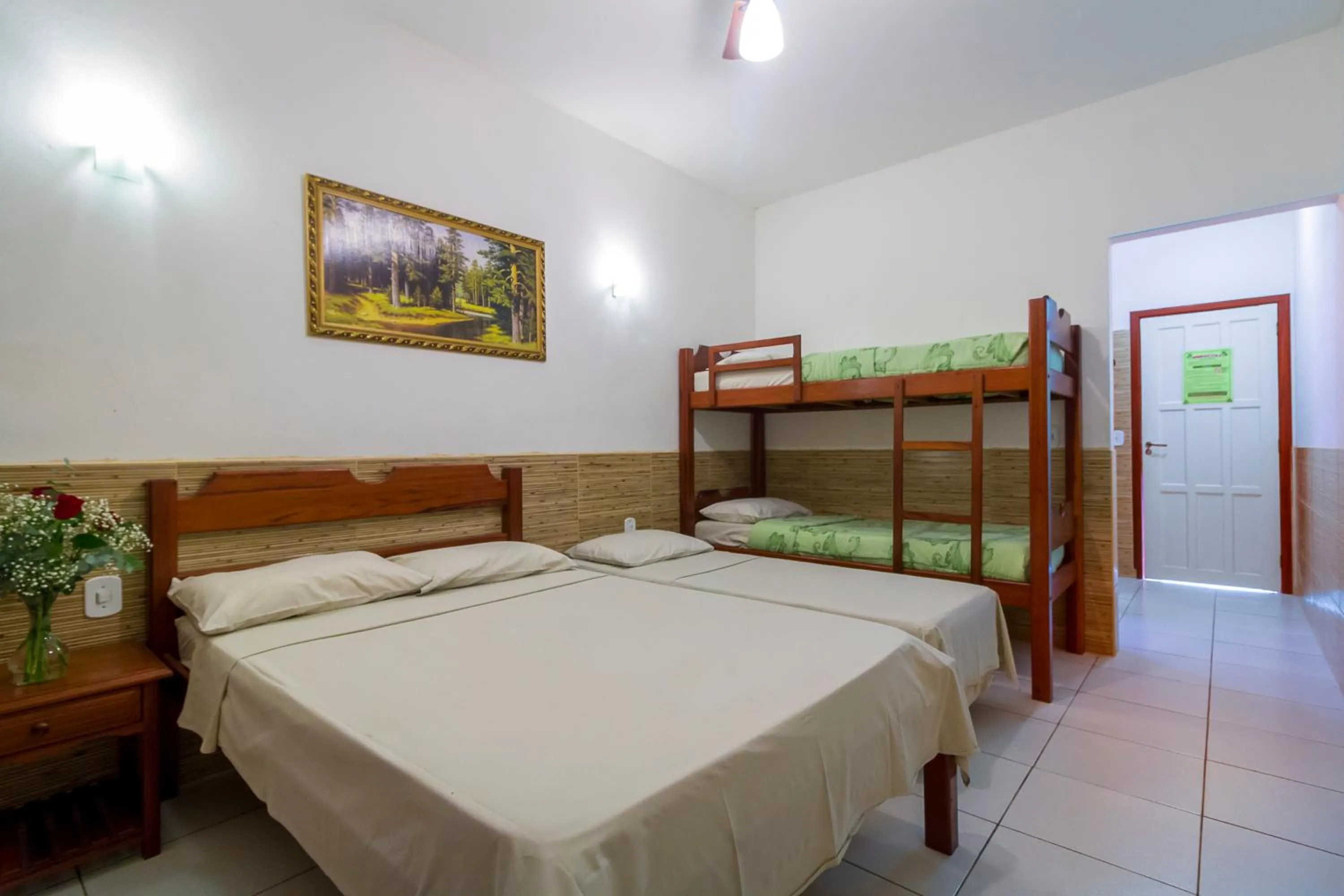 Bed in Pousada Camila