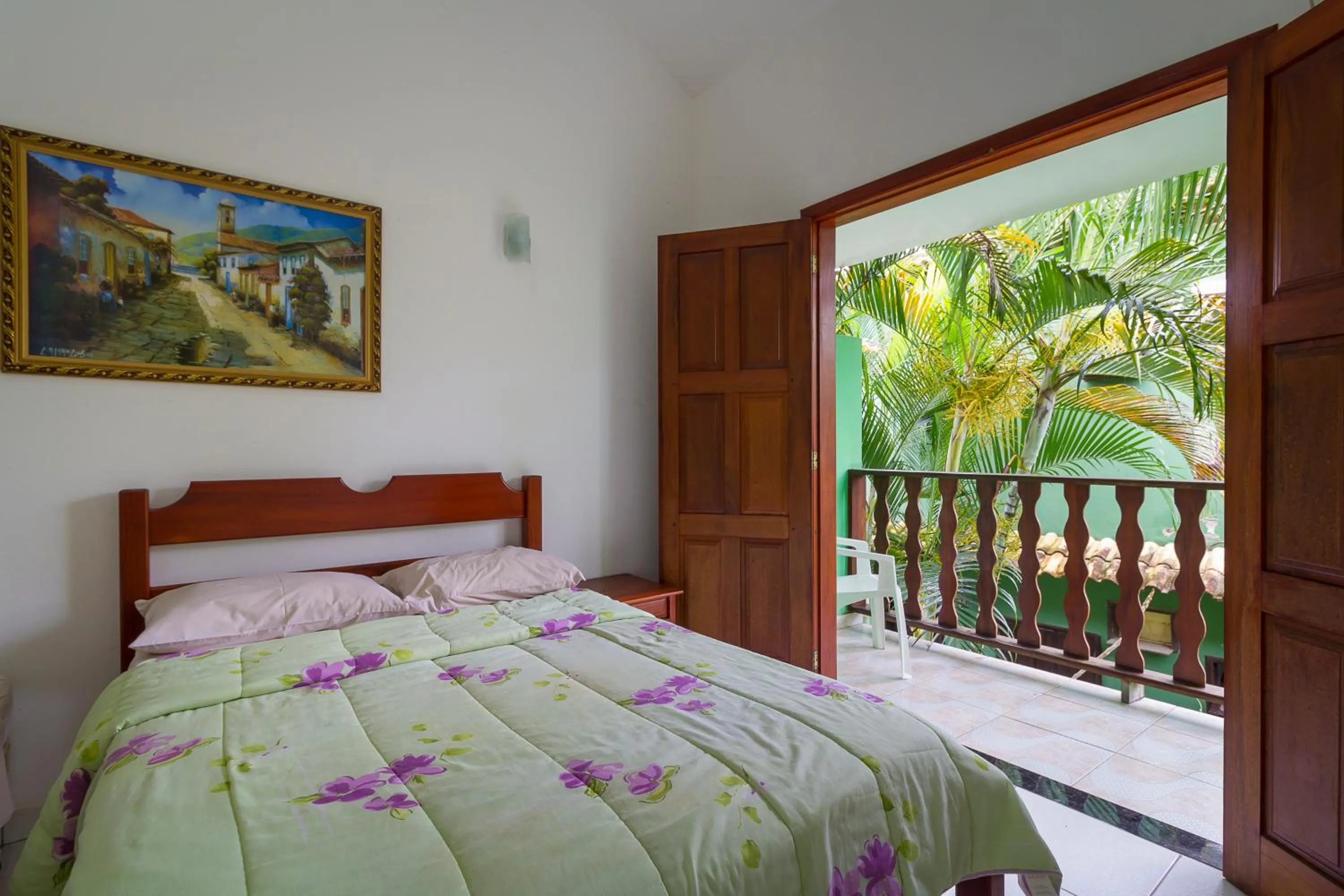 Bed in Pousada Camila