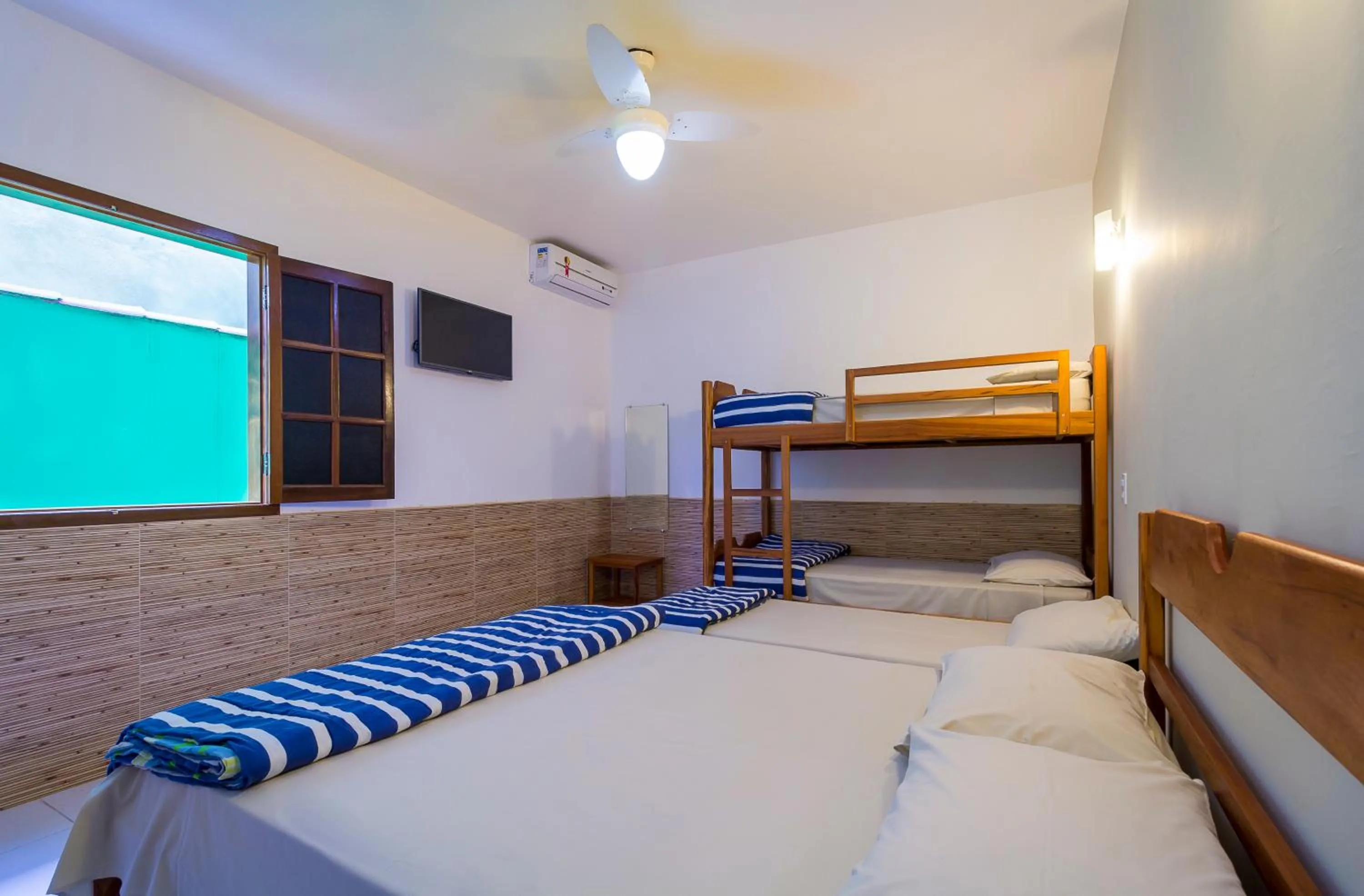 Bed in Pousada Camila