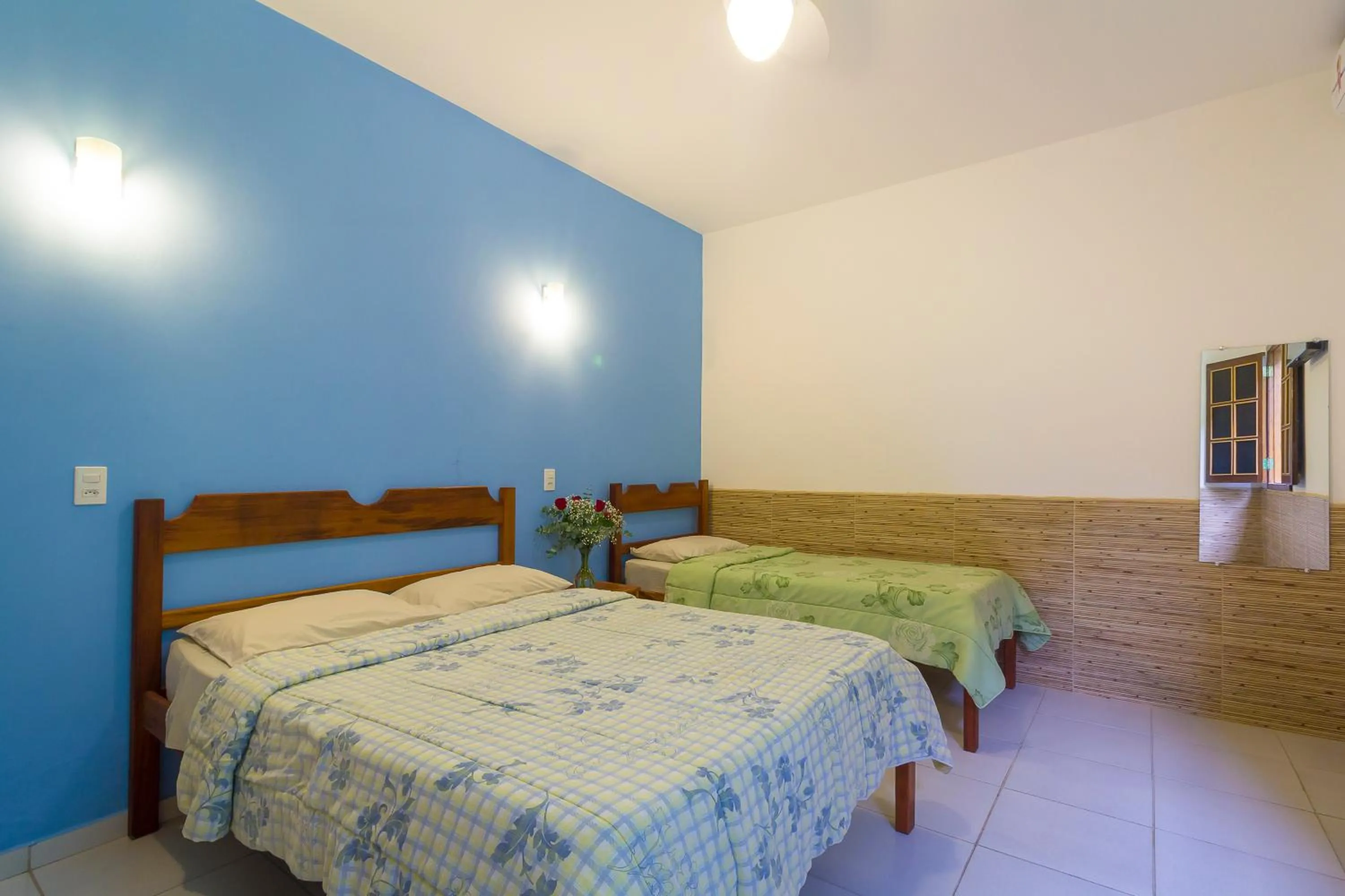 Bed in Pousada Camila