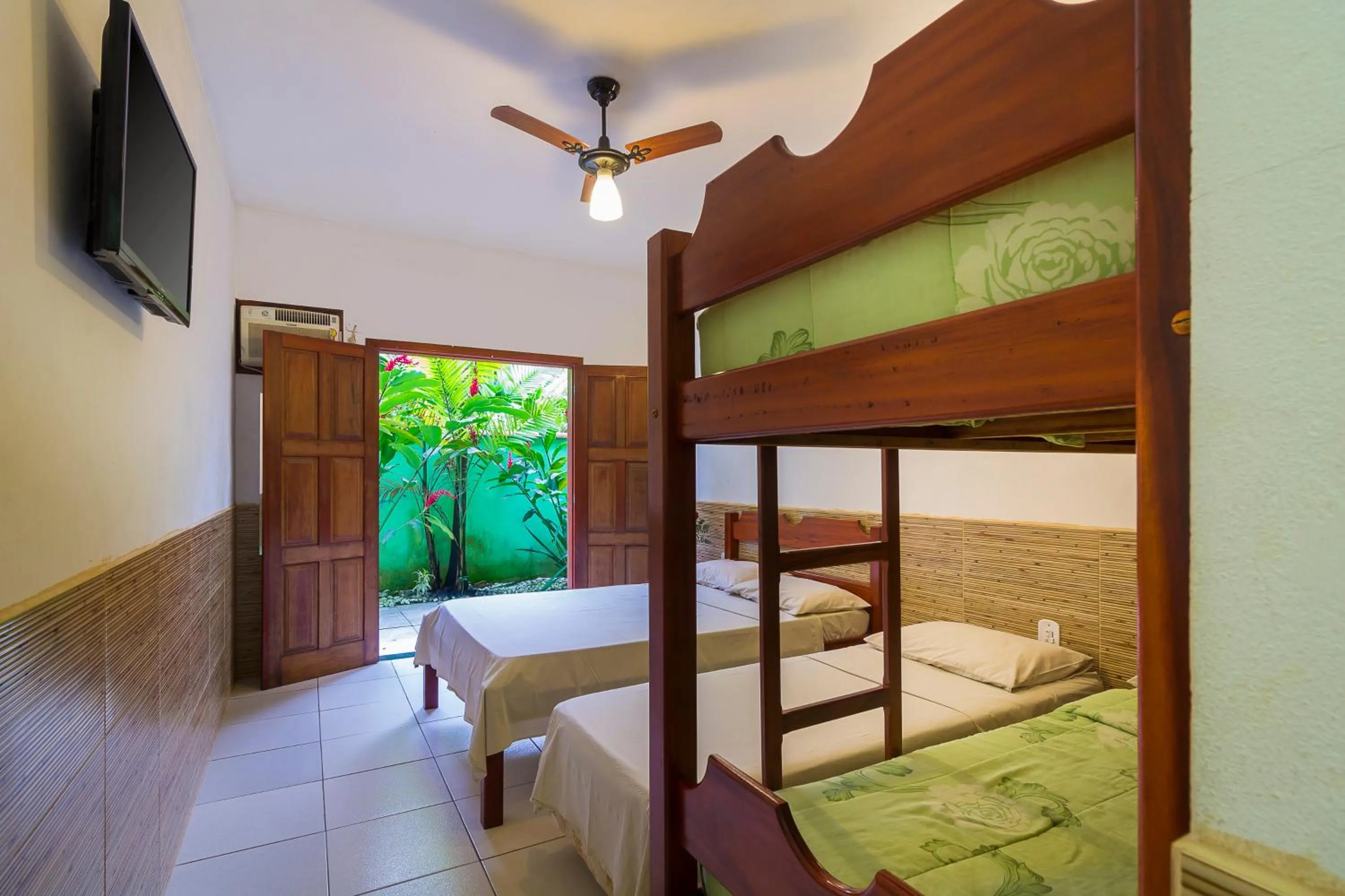 Bed in Pousada Camila