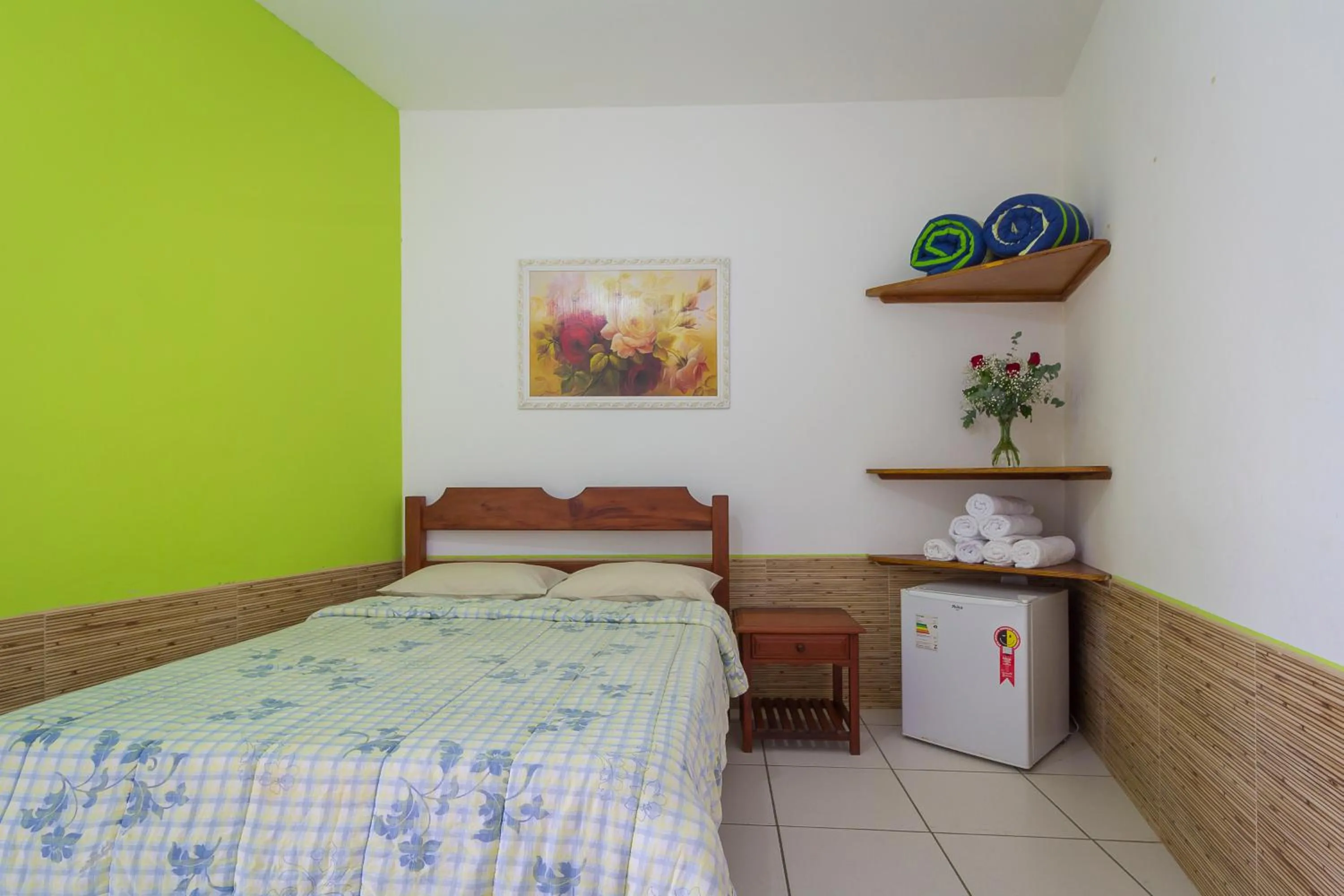 Bed in Pousada Camila
