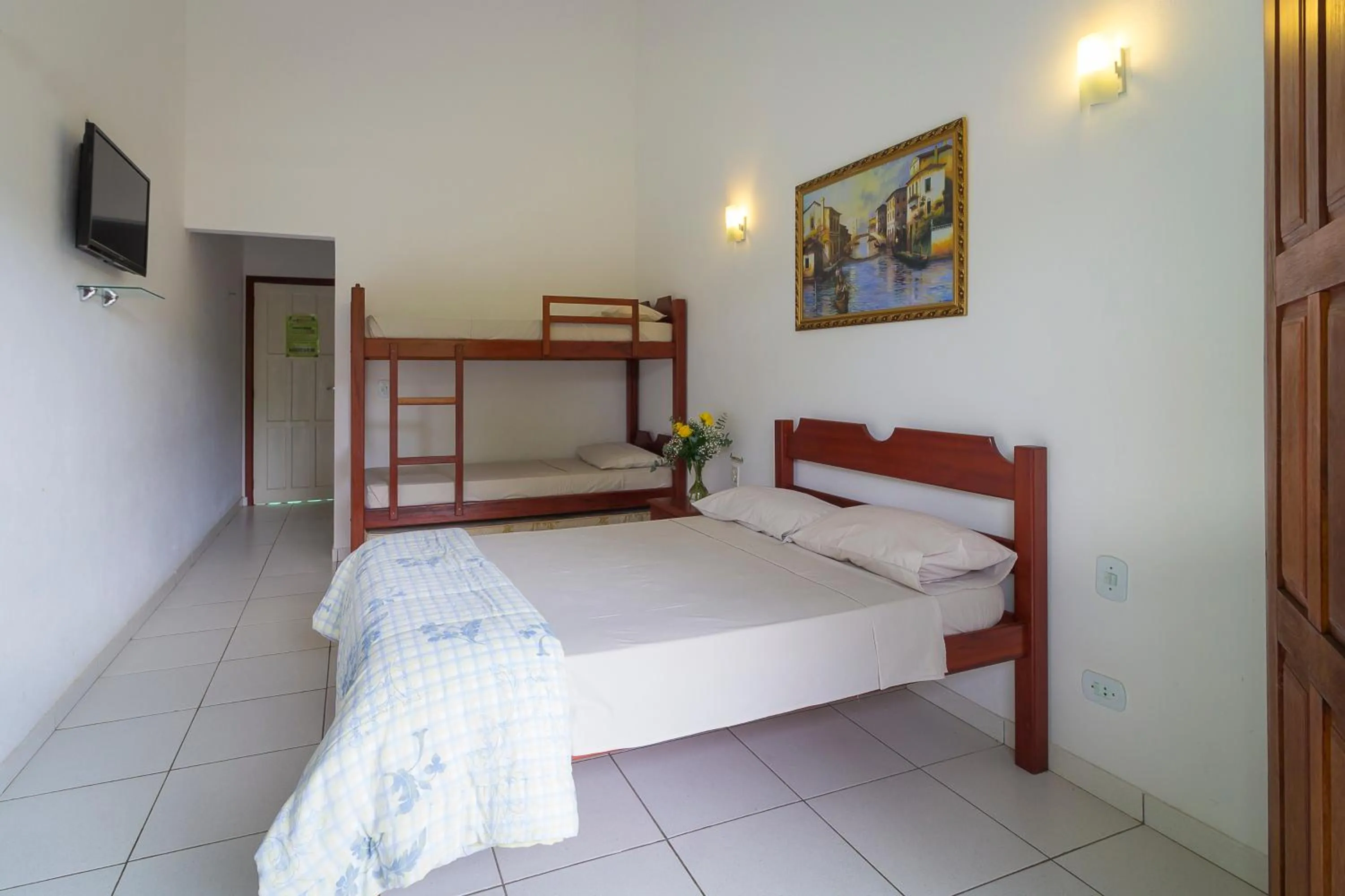 Bed in Pousada Camila