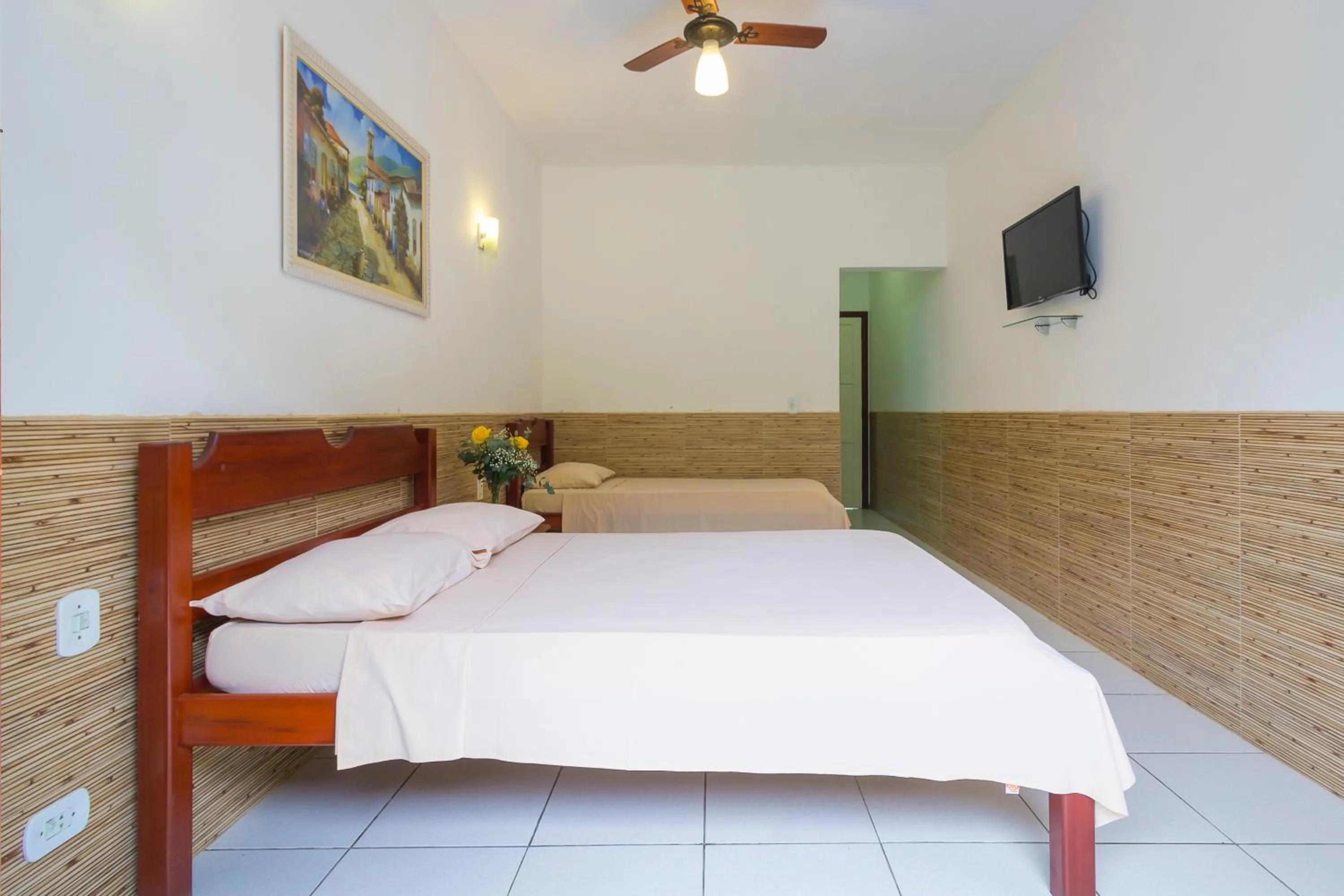Bed in Pousada Camila