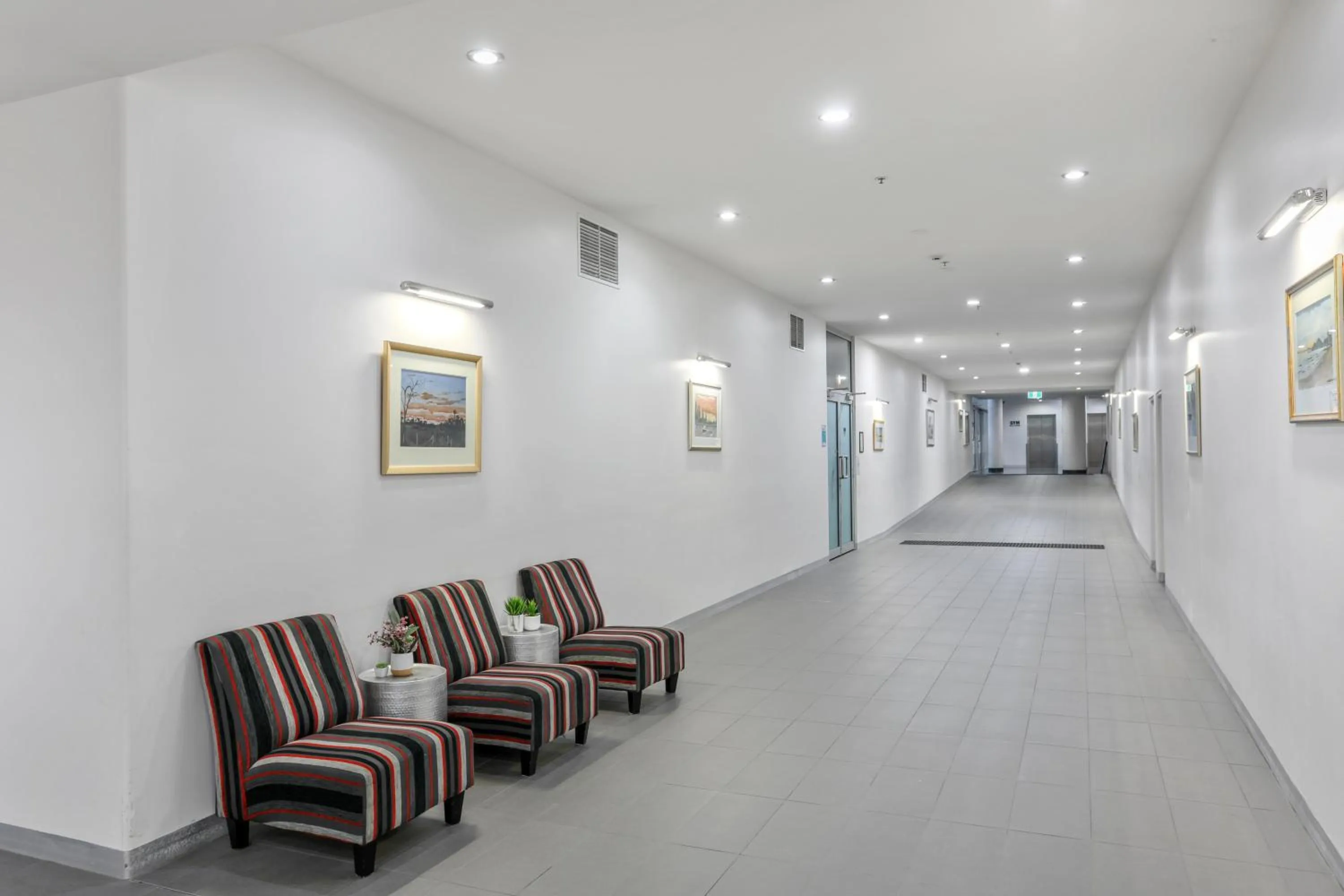 Seating area in Tweed Ultima Apartments