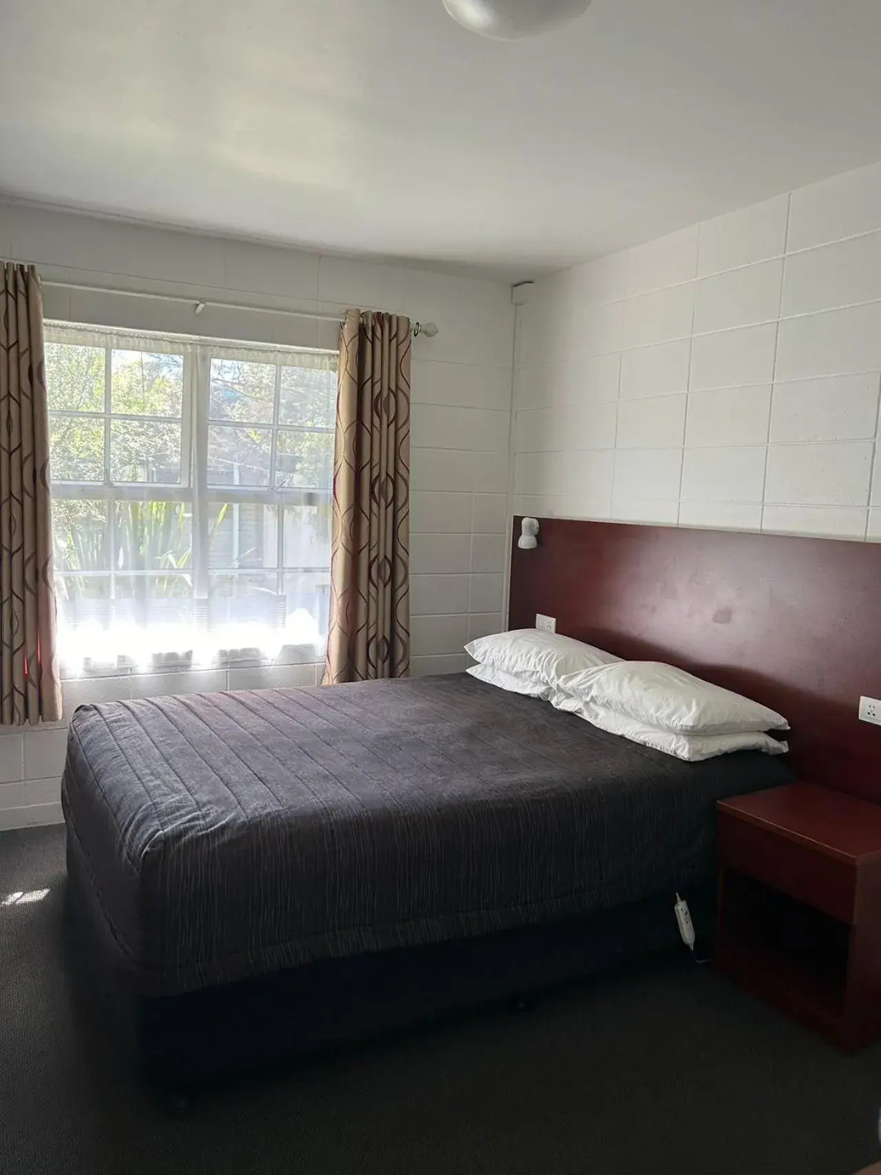 Bed in Tudor Motor Lodge Bed in Tudor Motor Lodge