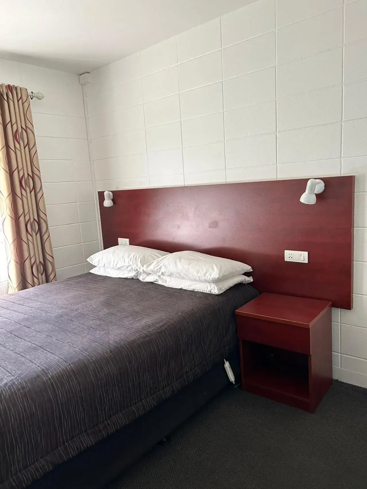 Bed in Tudor Motor Lodge Bed in Tudor Motor Lodge