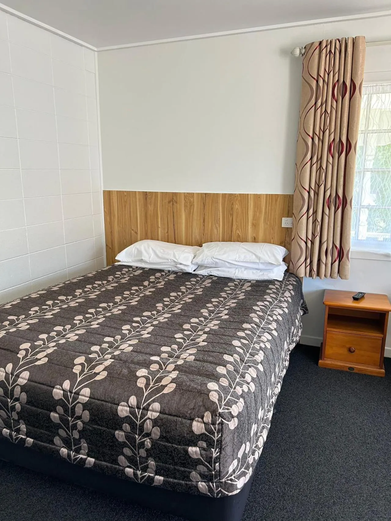 Bed in Tudor Motor Lodge