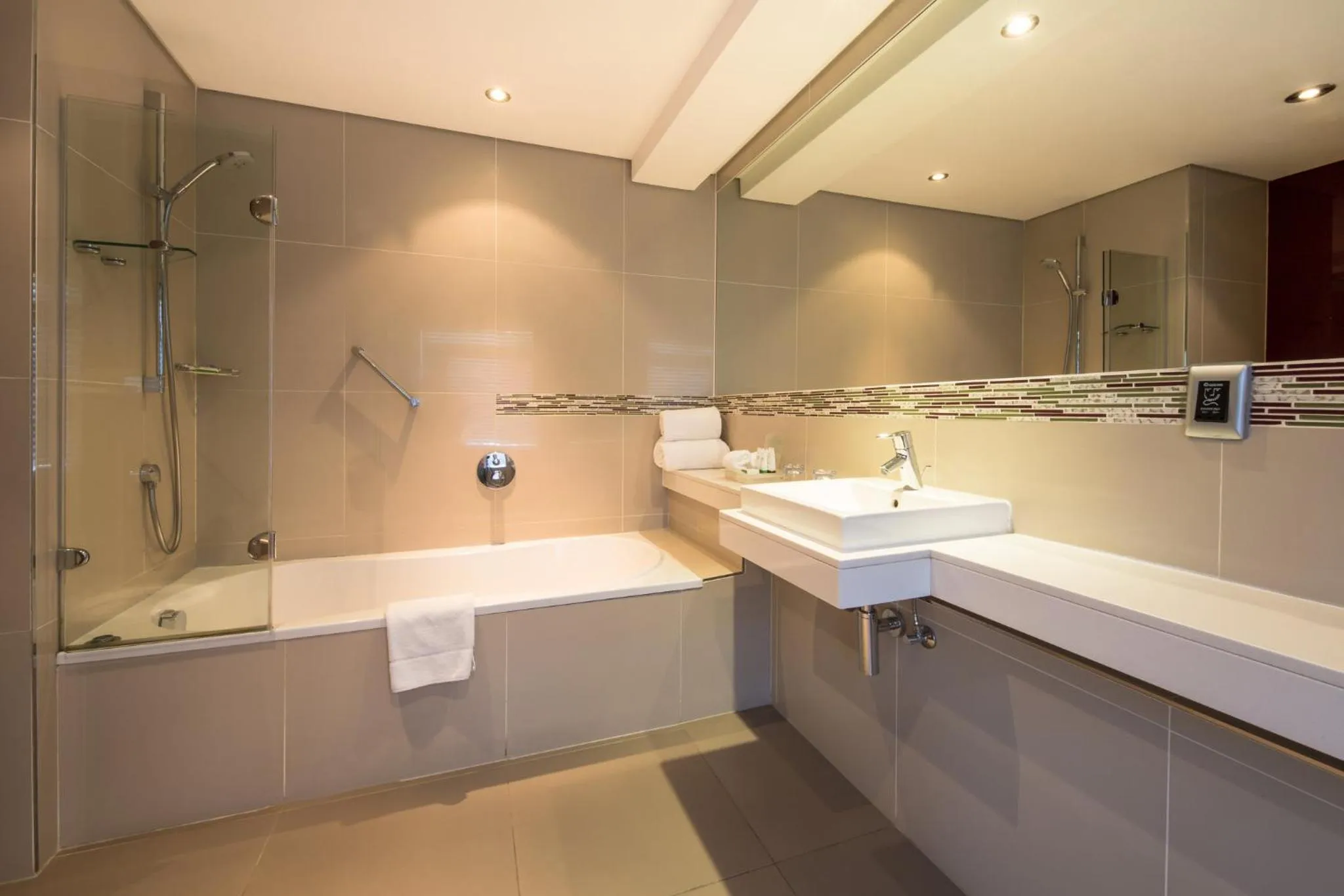 Bathroom in Holiday Inn Johannesburg-Rosebank by IHG