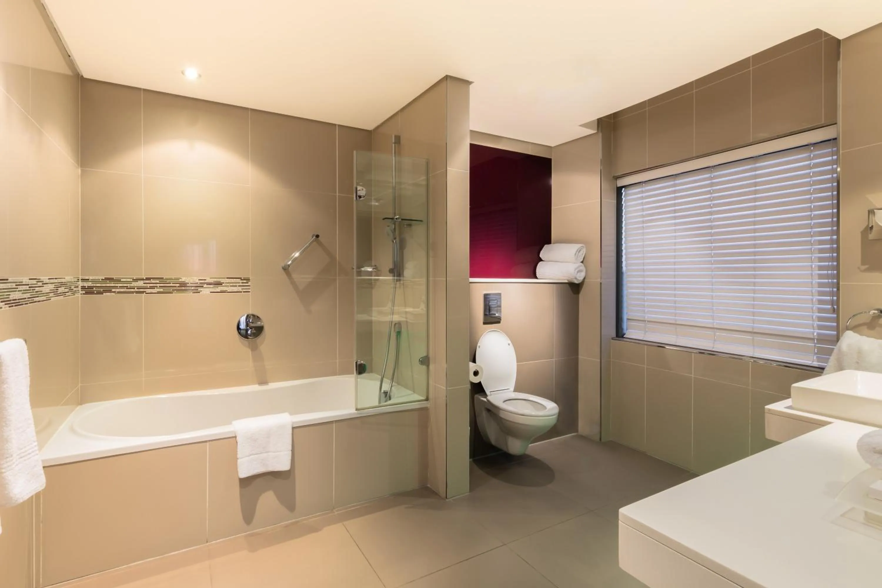 Bathroom in Holiday Inn Johannesburg-Rosebank by IHG