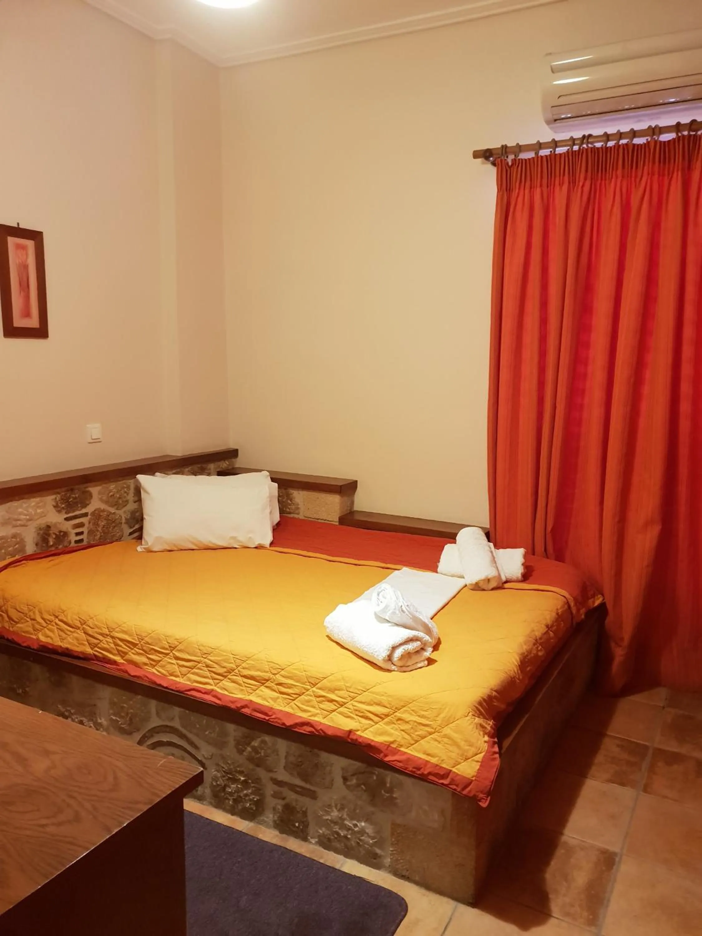 Bed in Aktaion Hotel