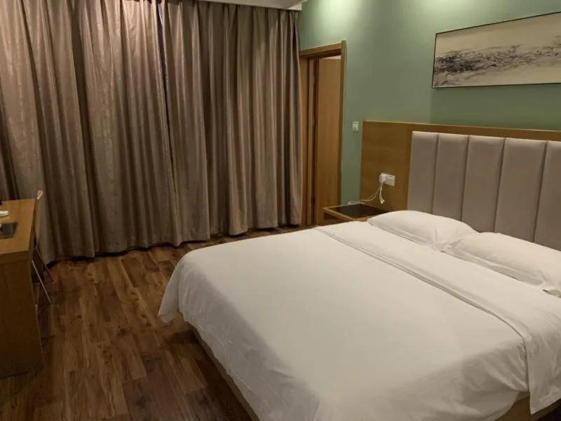 Bed in GreenTree Inn Suzhou Industrial Park Shengpu Town Xinsheng Road Express Hotel
