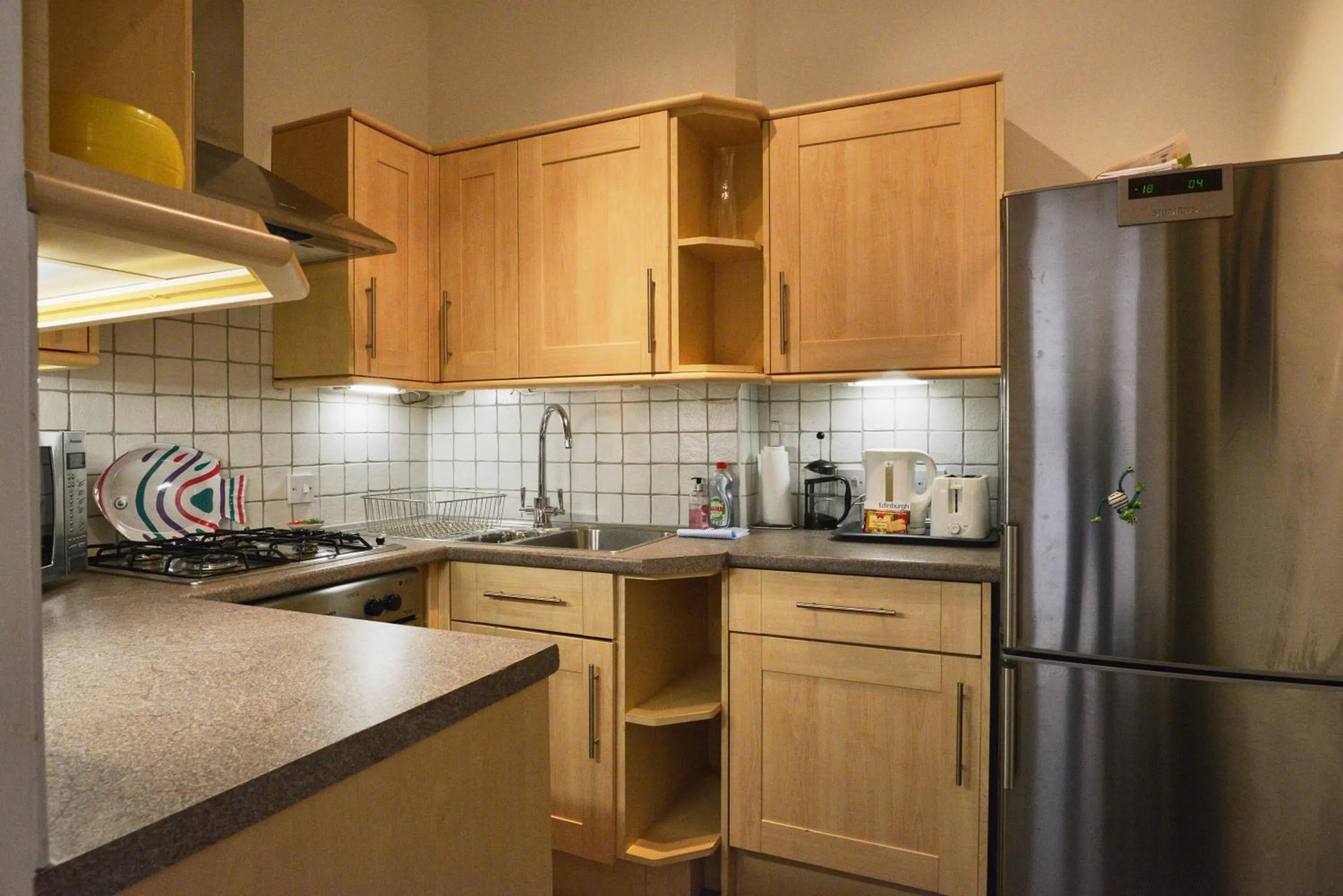 Kitchen or kitchenette in Comely Bank Apartment