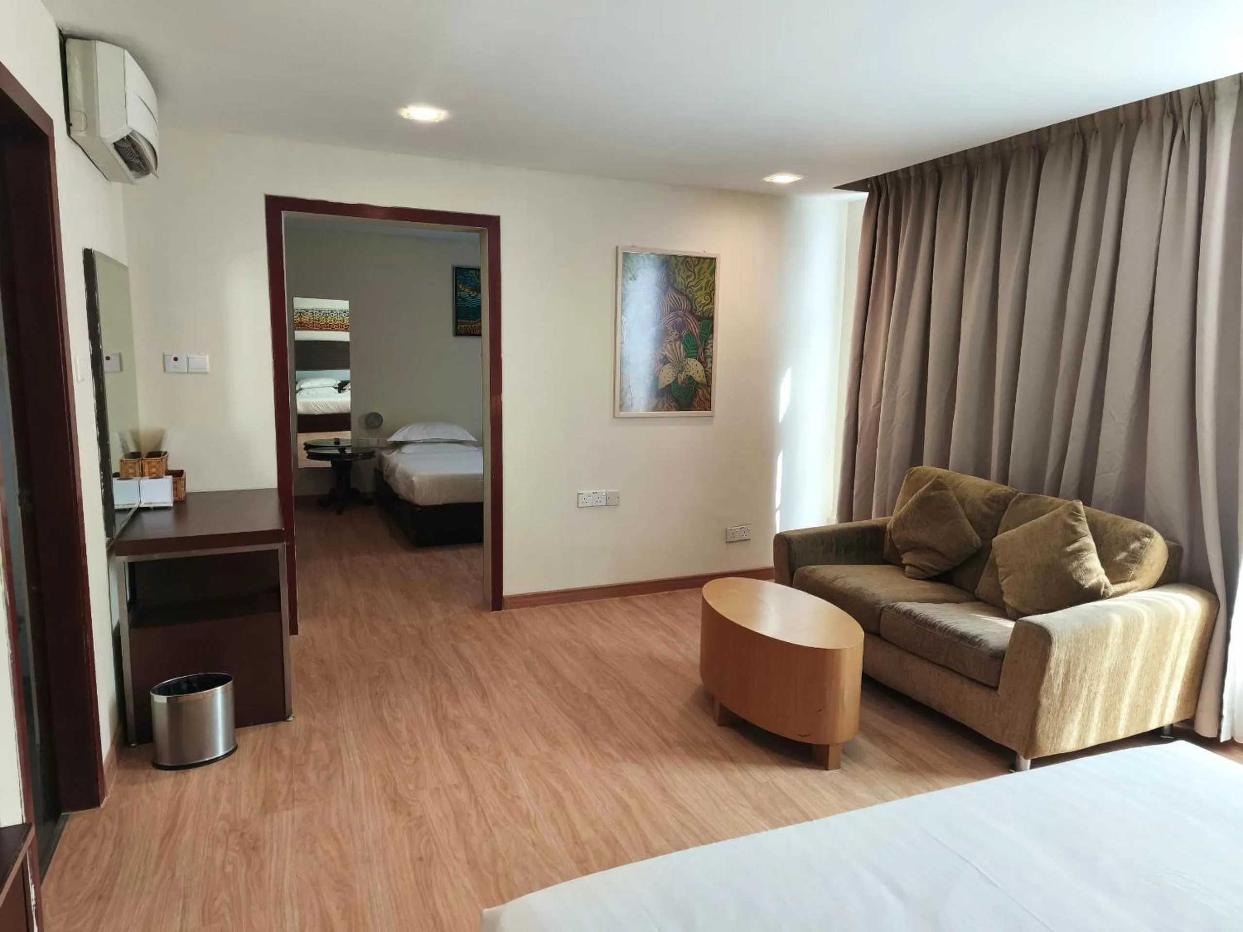 Living room, Bed in Kinabalu Daya Hotel