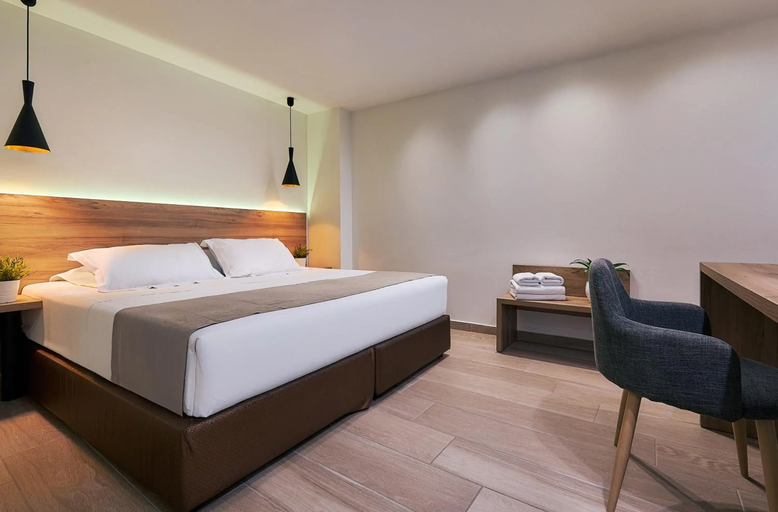 Bed in Dionisos Hotel Bed in Dionisos Hotel