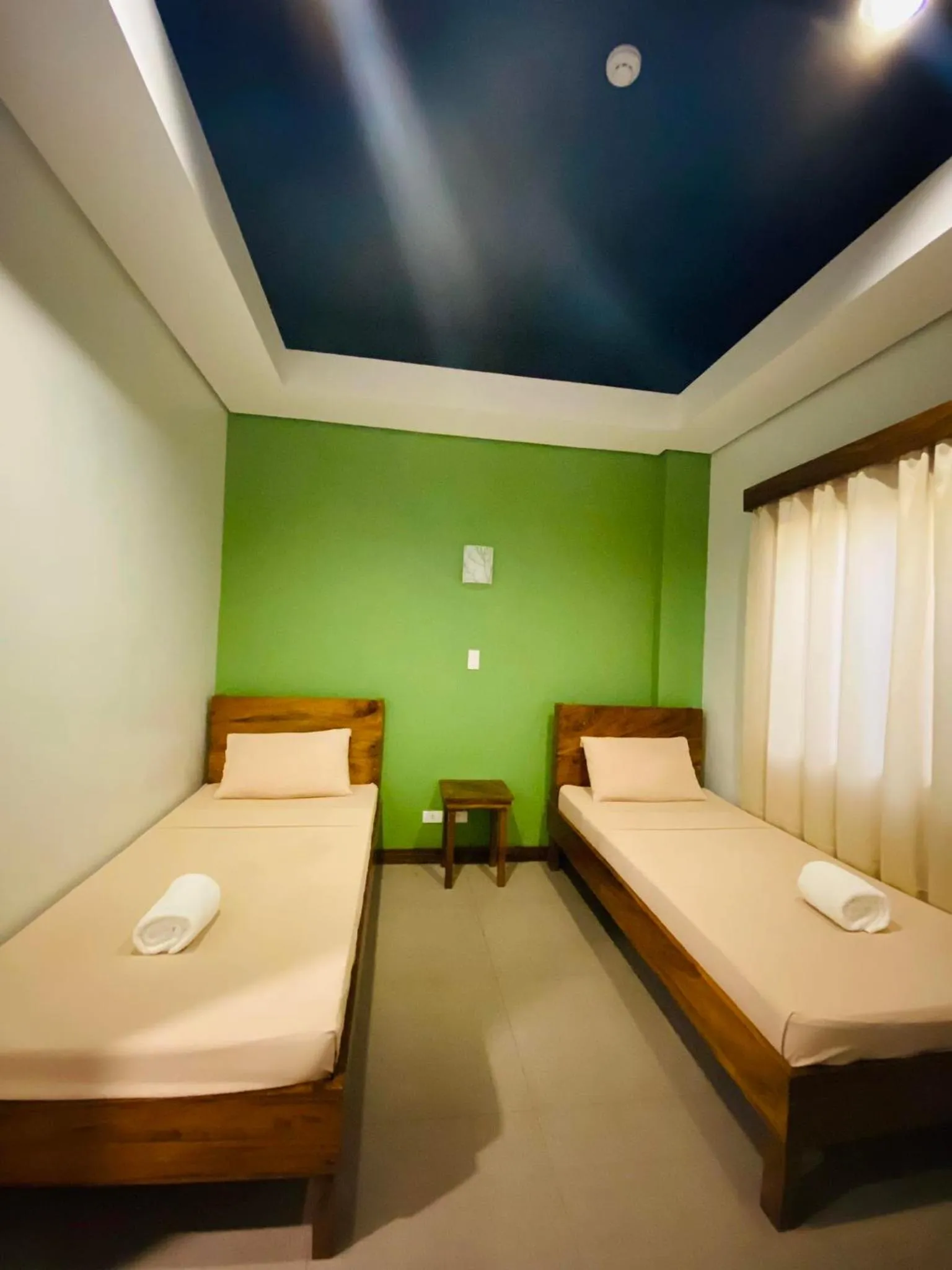 Bed in Acacia Garden Inn and Suites