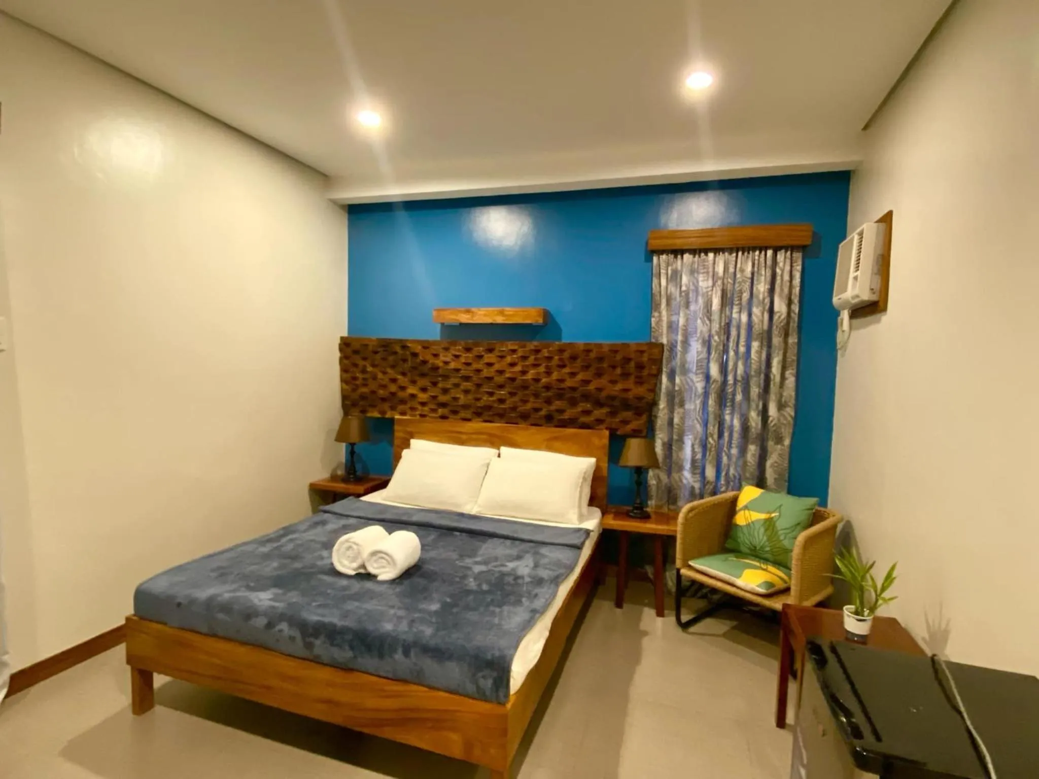 Bed in Acacia Garden Inn and Suites