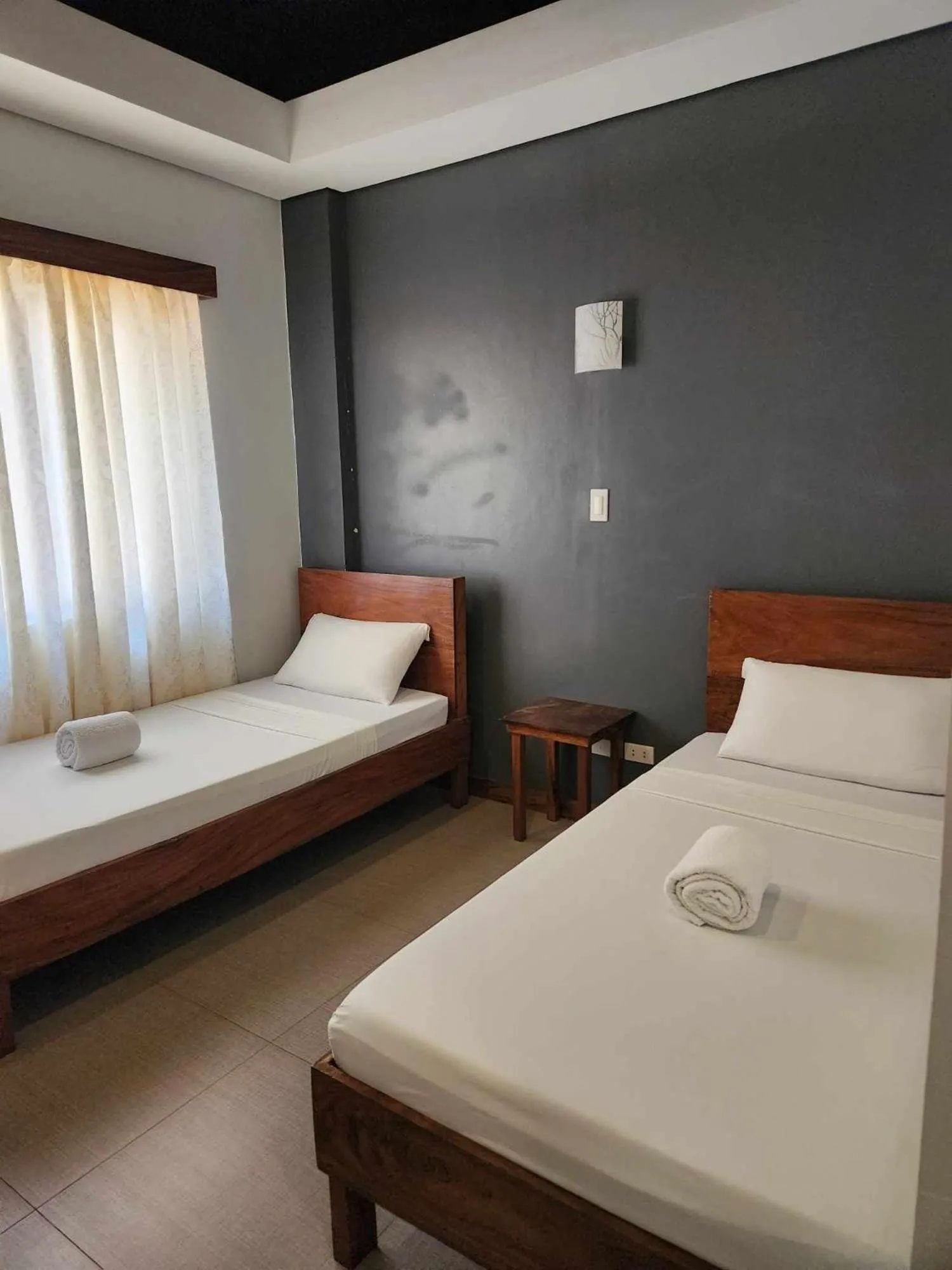 Bed in Acacia Garden Inn and Suites