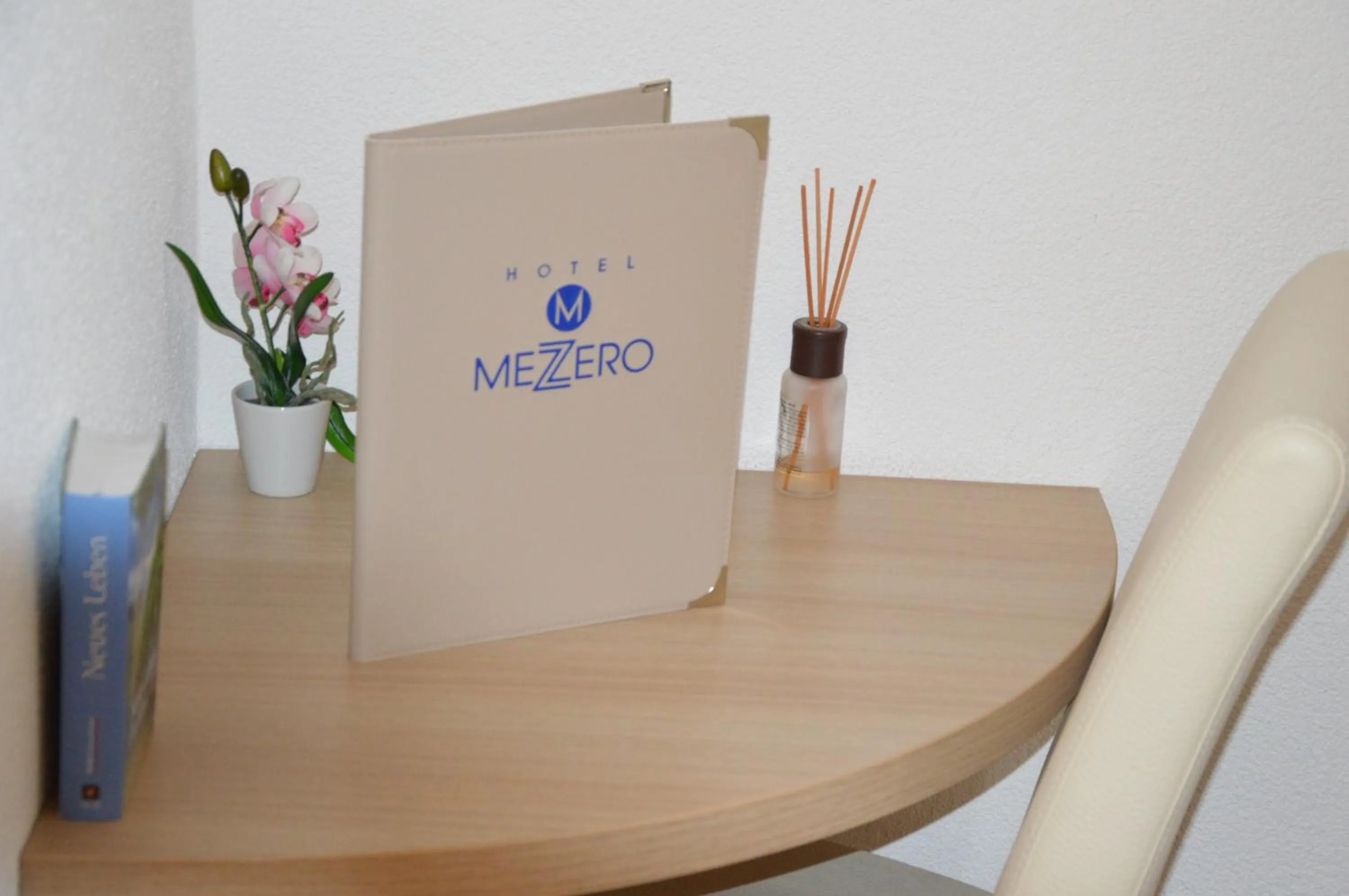 Property logo or sign in Hotel Mezzero