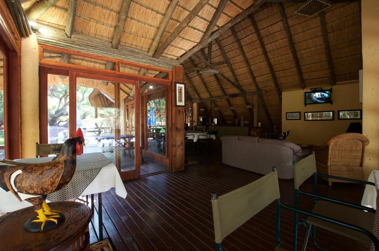 Communal lounge/ TV room in Tuskers Bush Lodge B&B