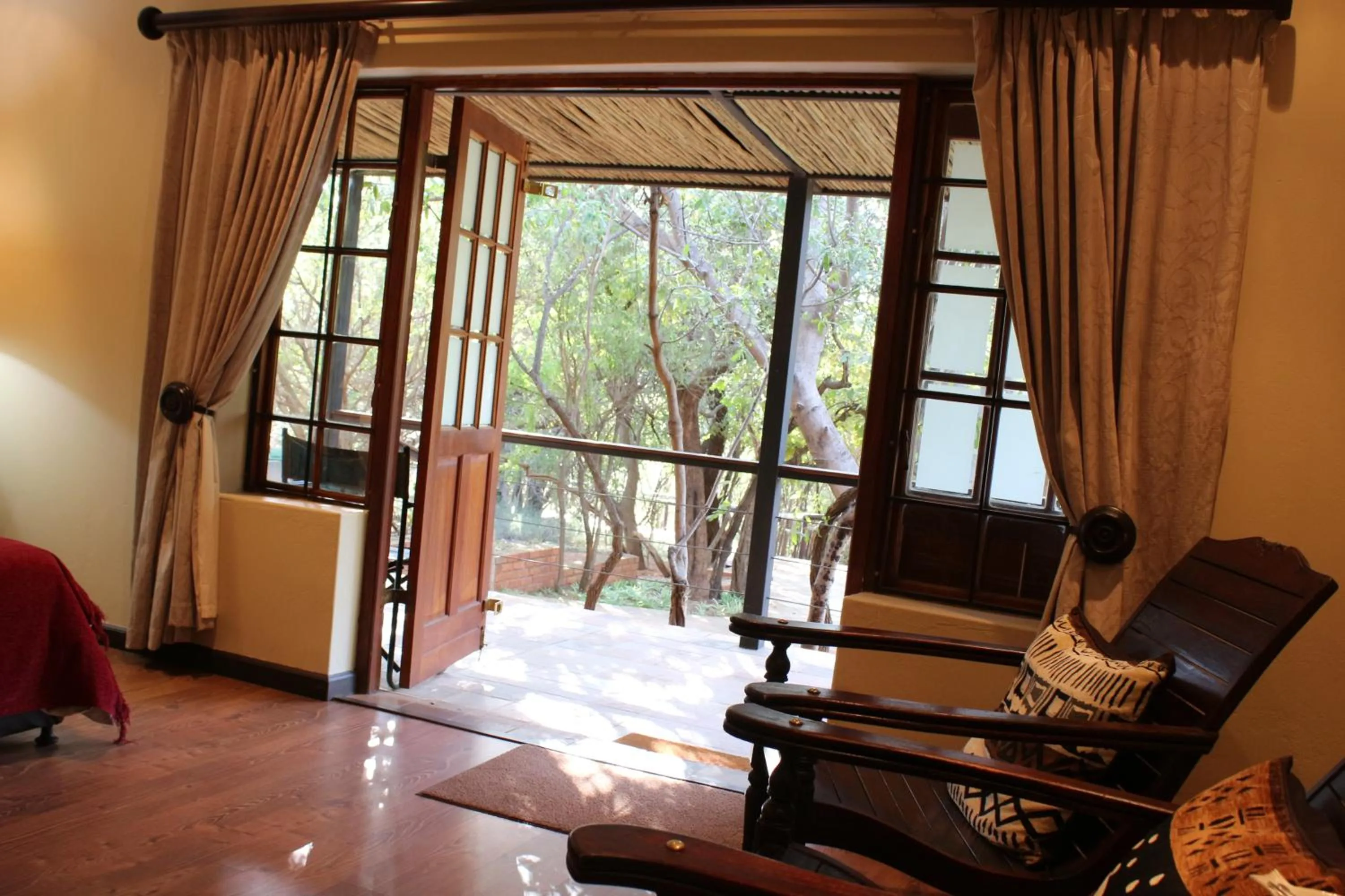 Seating area in Tuskers Bush Lodge B&B