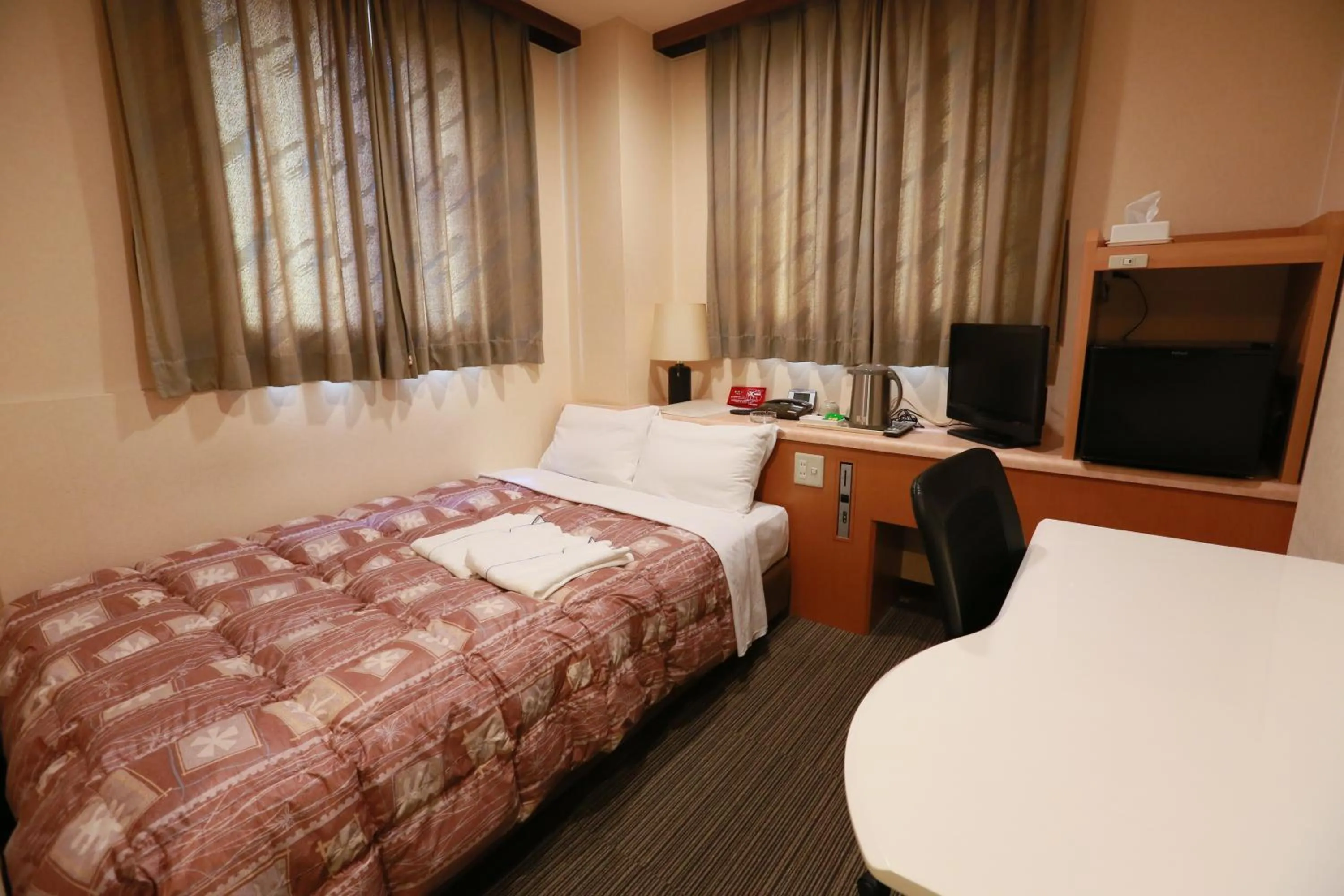 Bed in Hotel Ikeda