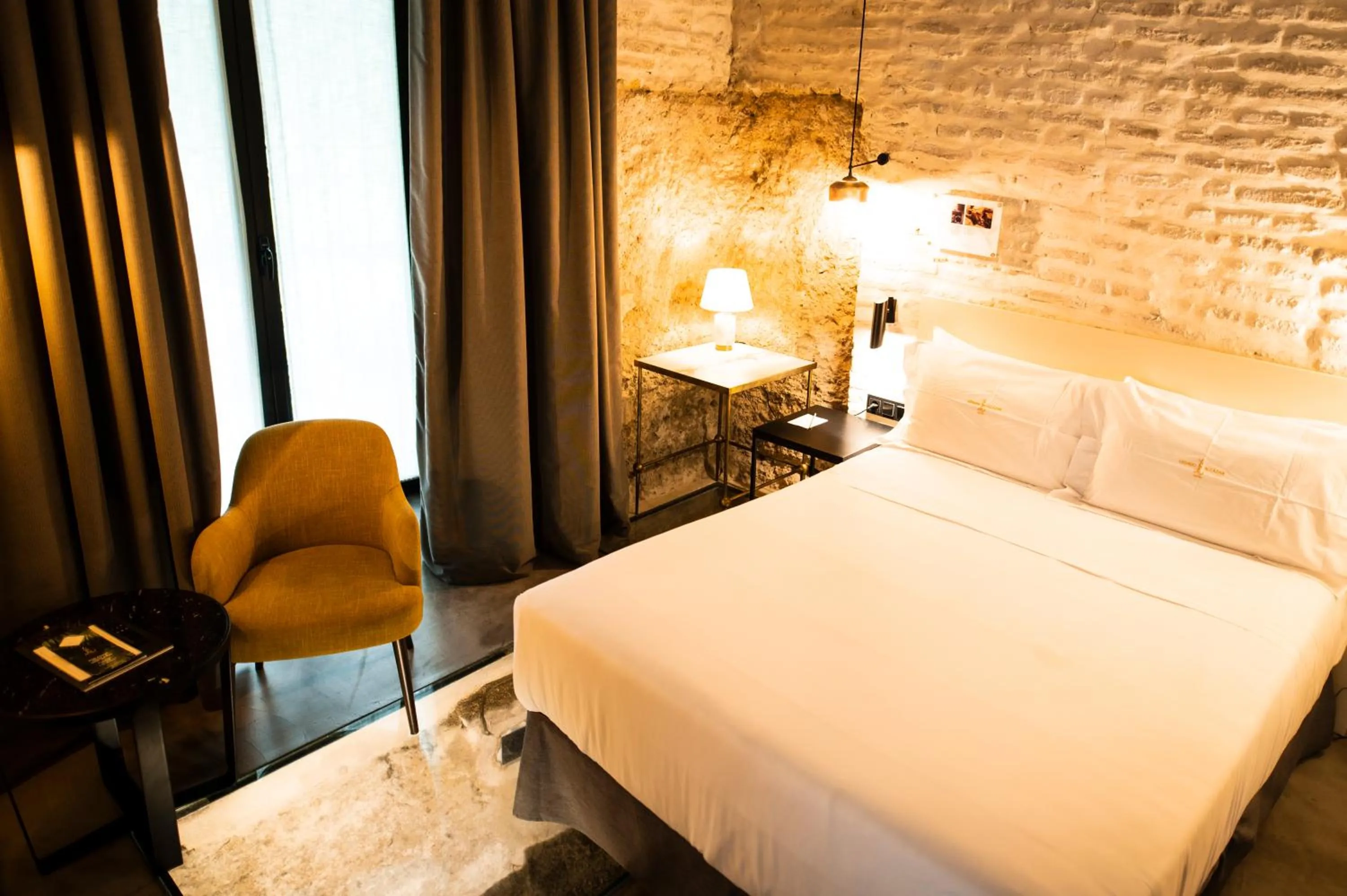 Bed in Legado Alcazar Hotel