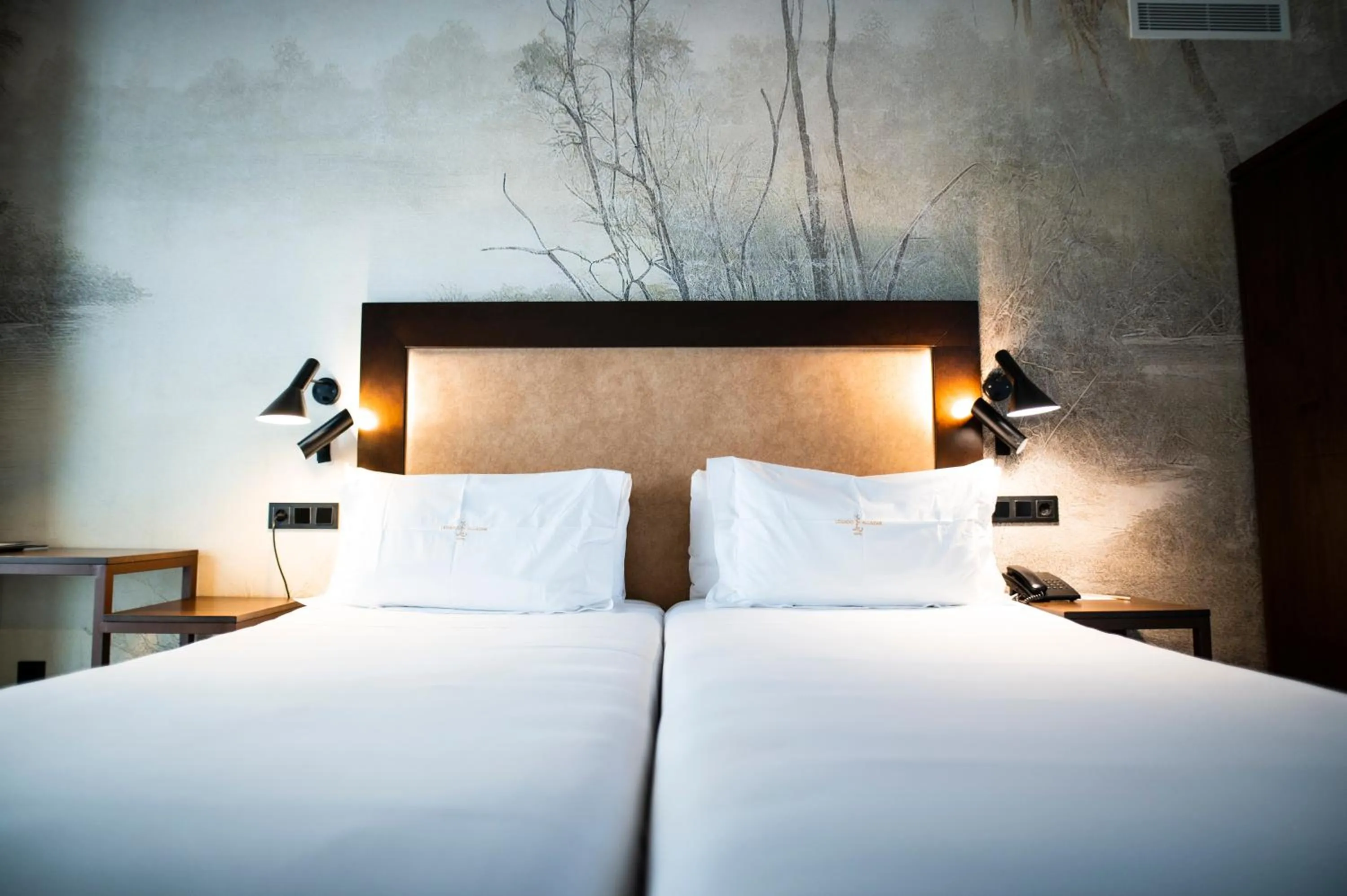 Bed in Legado Alcazar Hotel