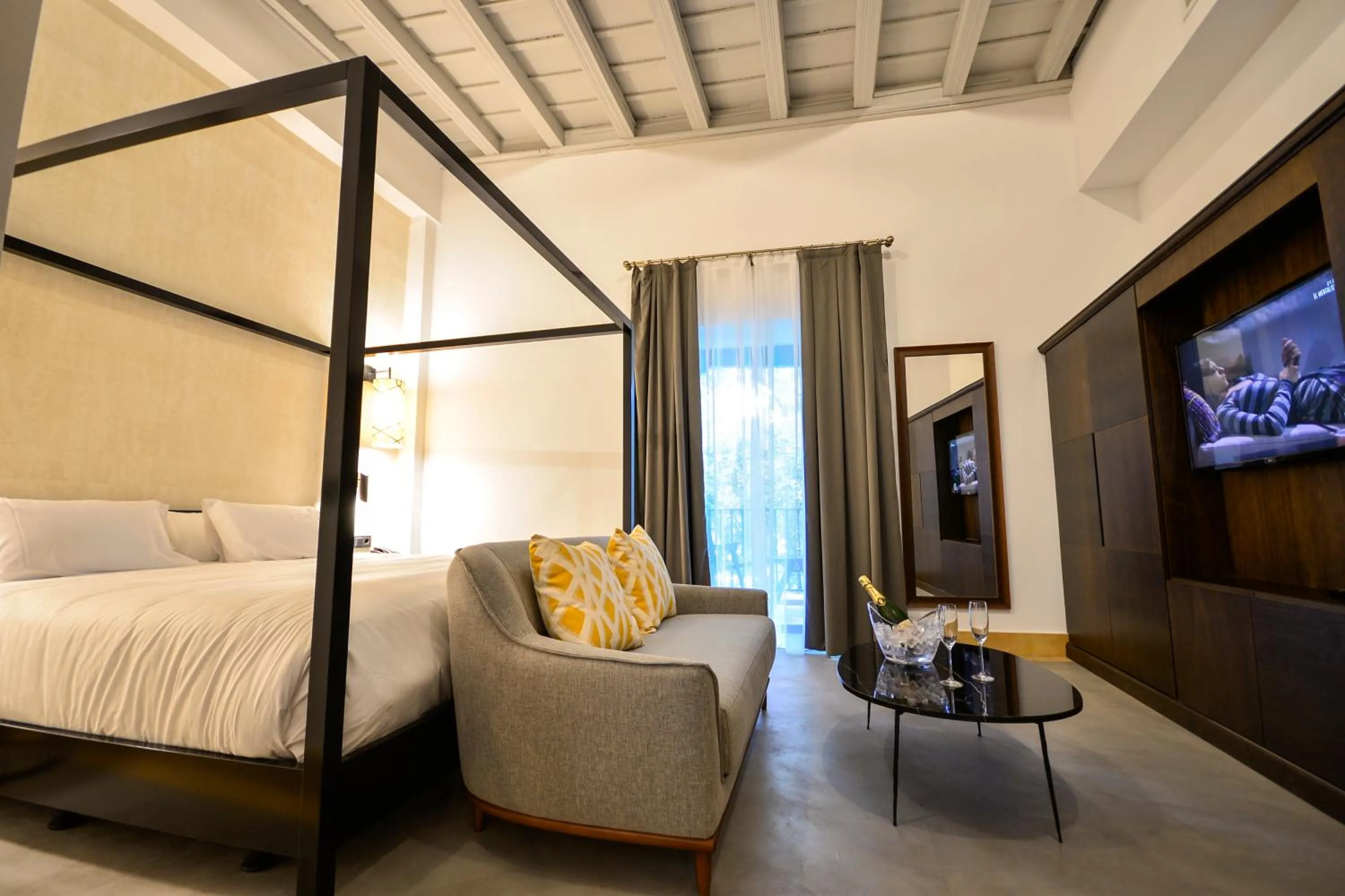 Seating area, Bed in Legado Alcazar Hotel