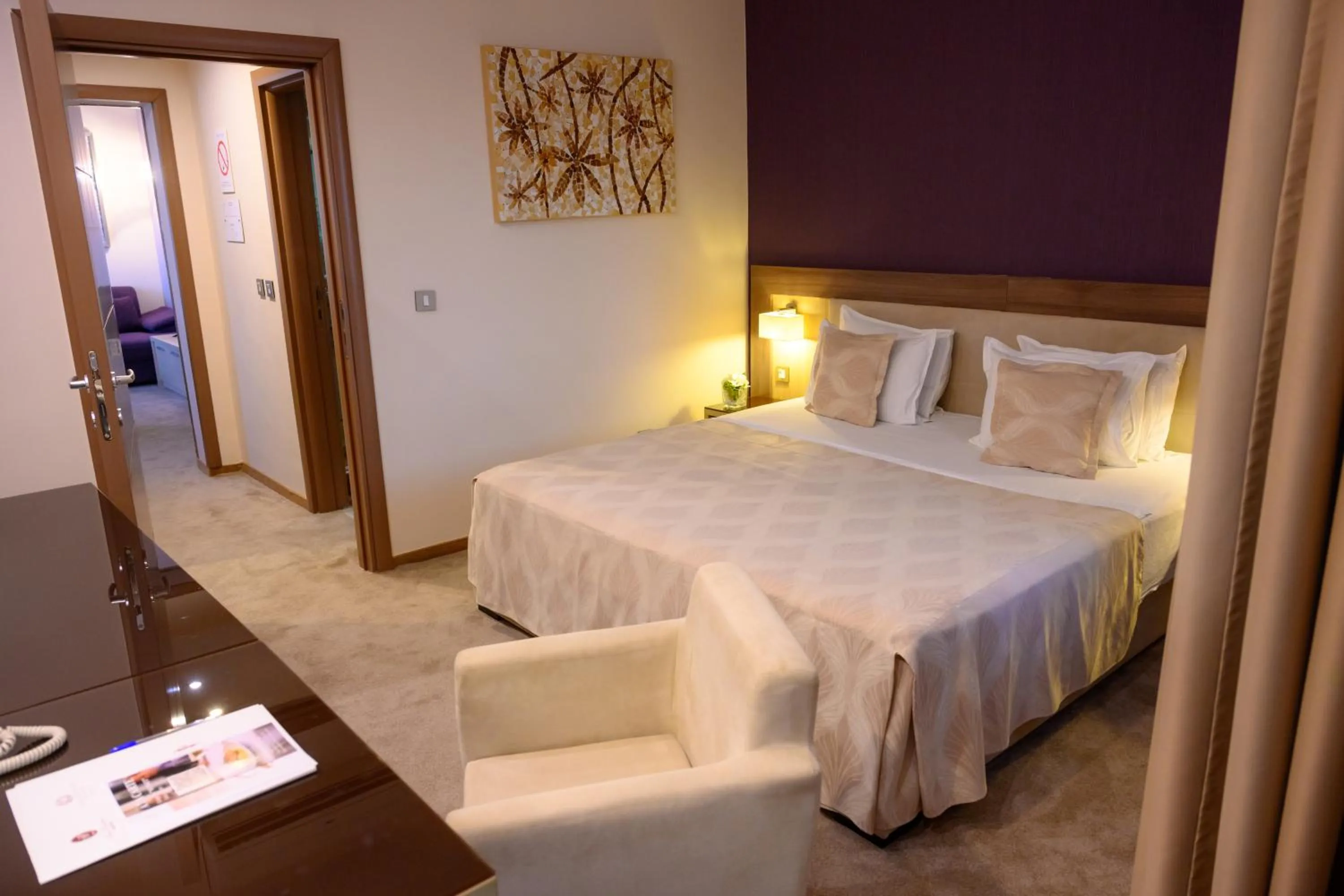 Bed in Hotel Tami Residence