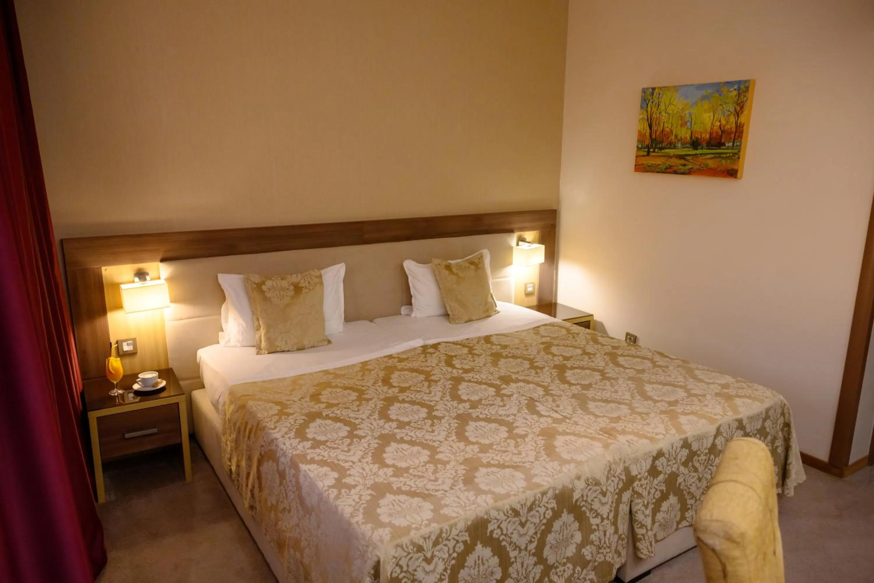 Bed in Hotel Tami Residence