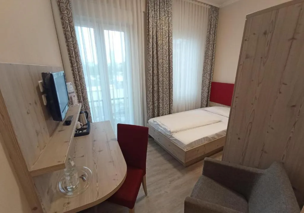 Photo of the whole room, Bed in TRIP INN PostHotel Düren