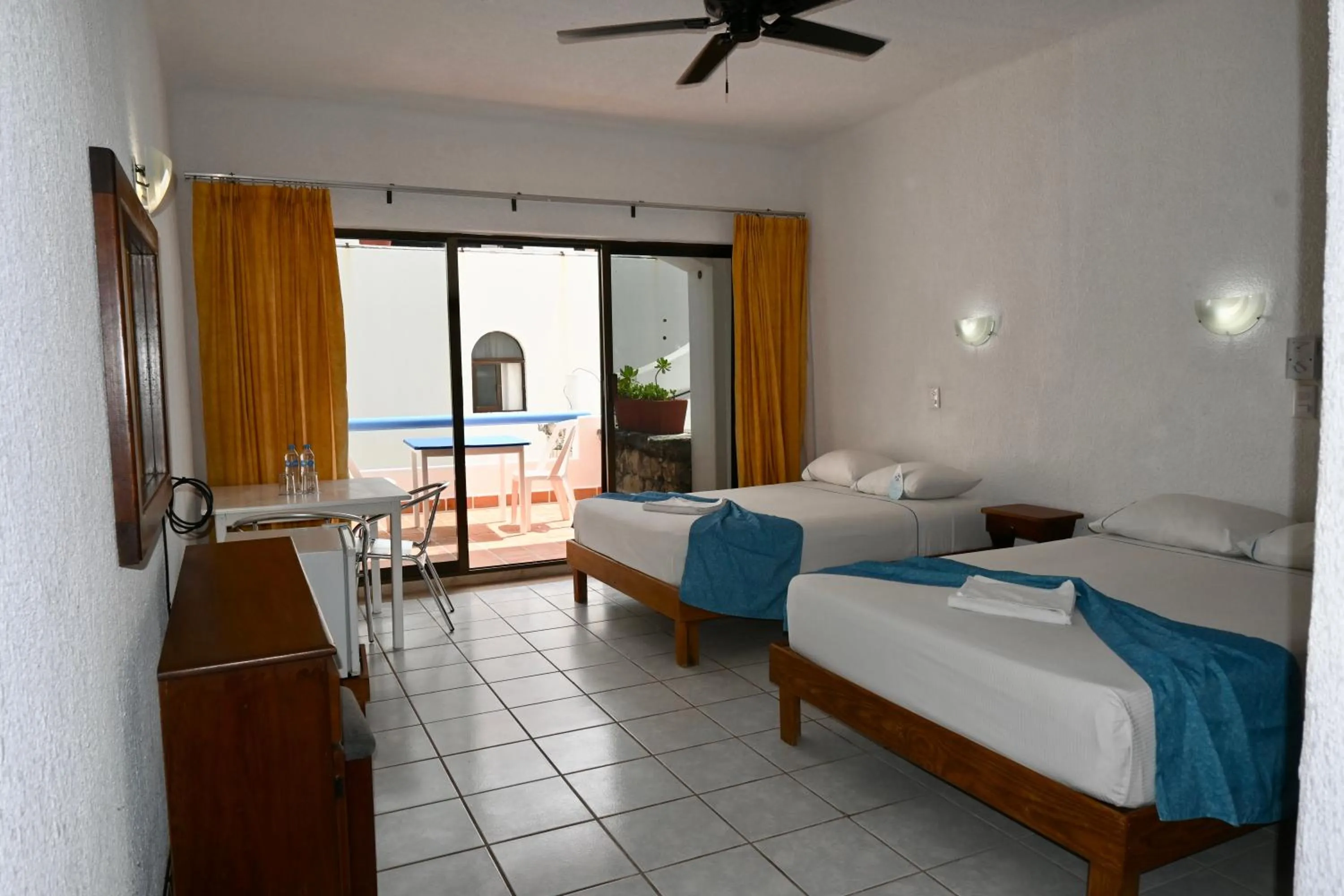 Bed in Pelicano Inn Playa del Carmen - Beachfront Hotel