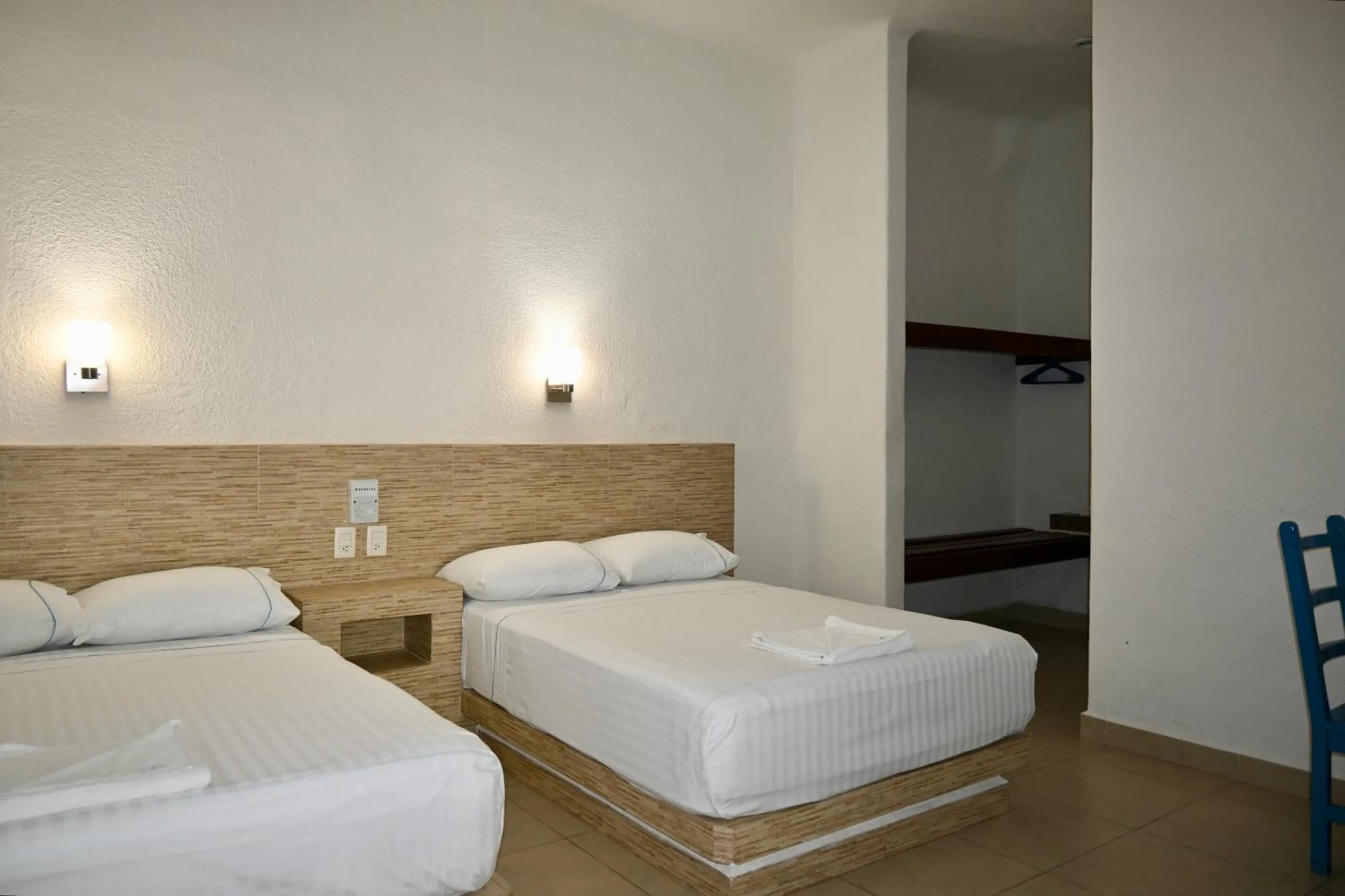 Bed in Pelicano Inn Playa del Carmen - Beachfront Hotel