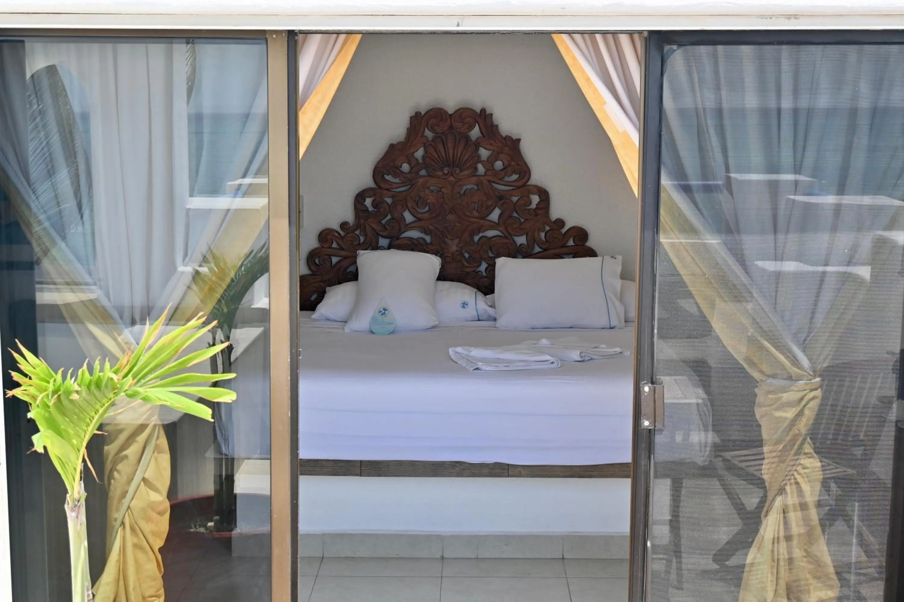 Bed in Pelicano Inn Playa del Carmen - Beachfront Hotel