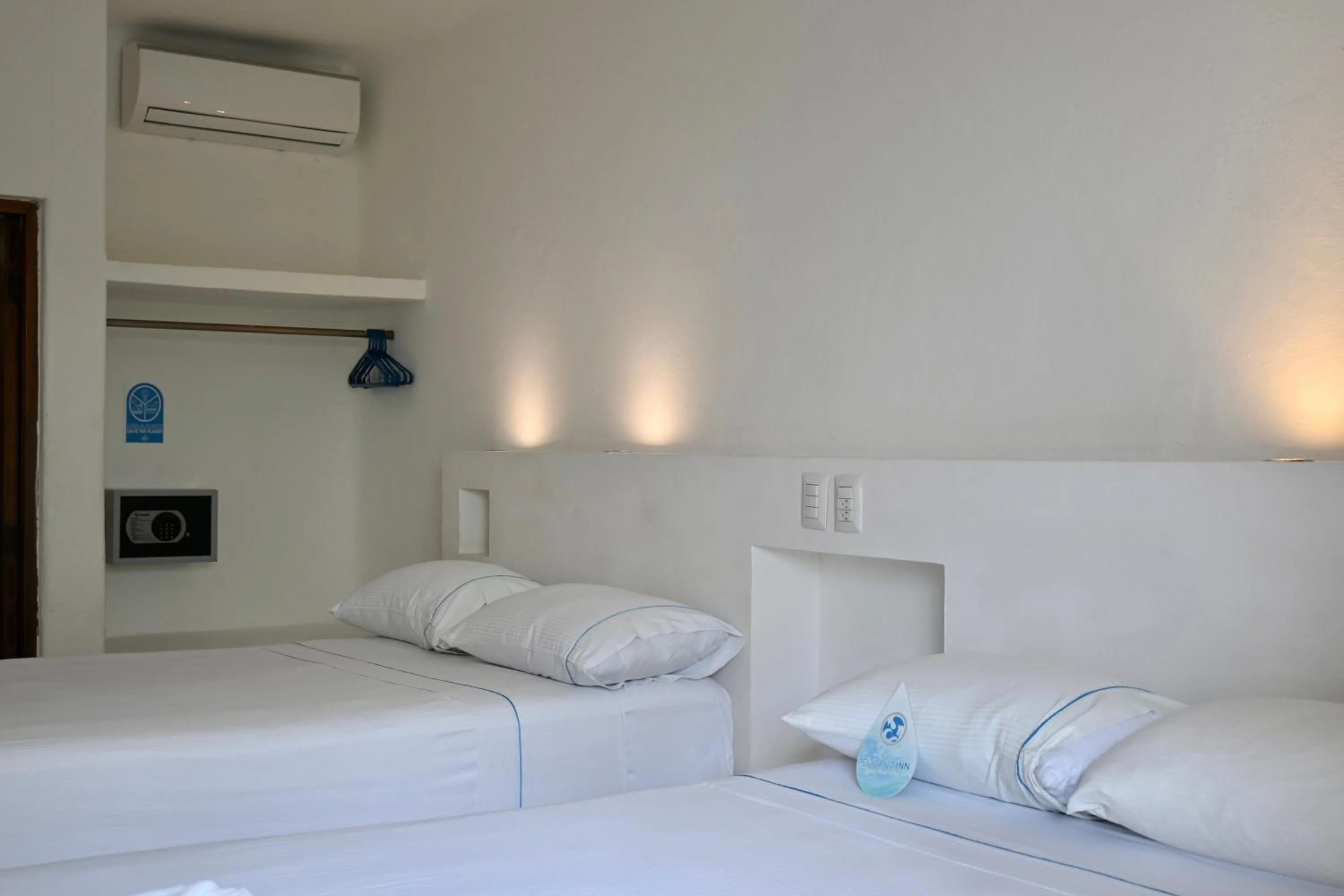 Bed in Pelicano Inn Playa del Carmen - Beachfront Hotel