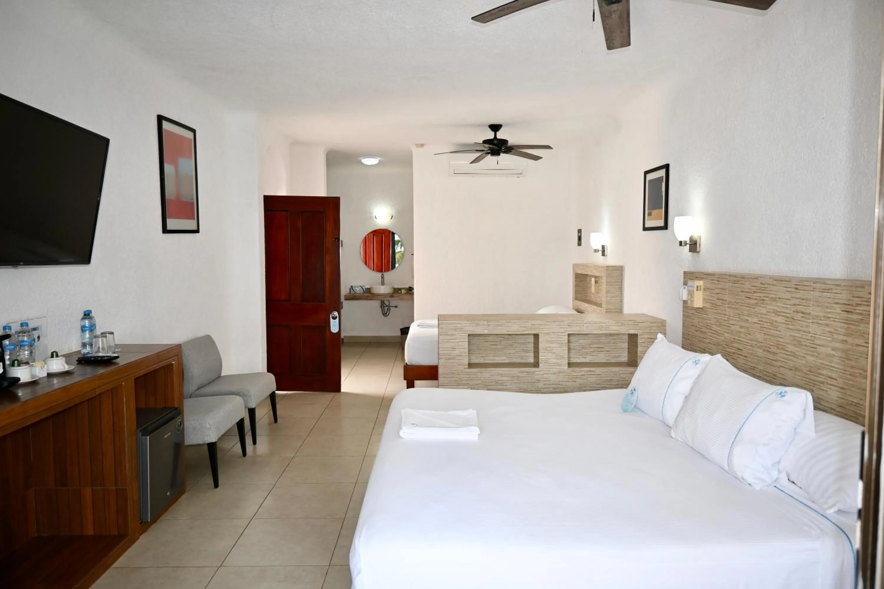 Bed in Pelicano Inn Playa del Carmen - Beachfront Hotel