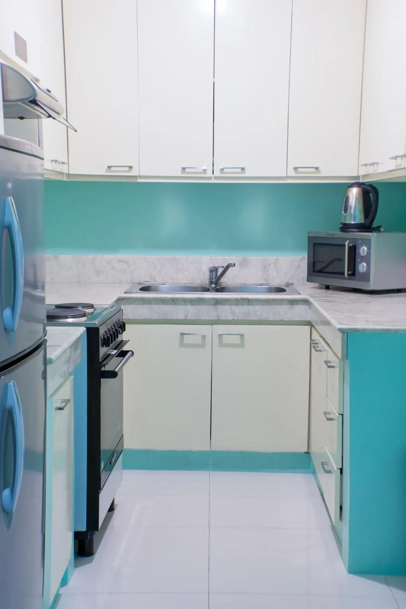 Kitchen or kitchenette in Parque España Residence Hotel