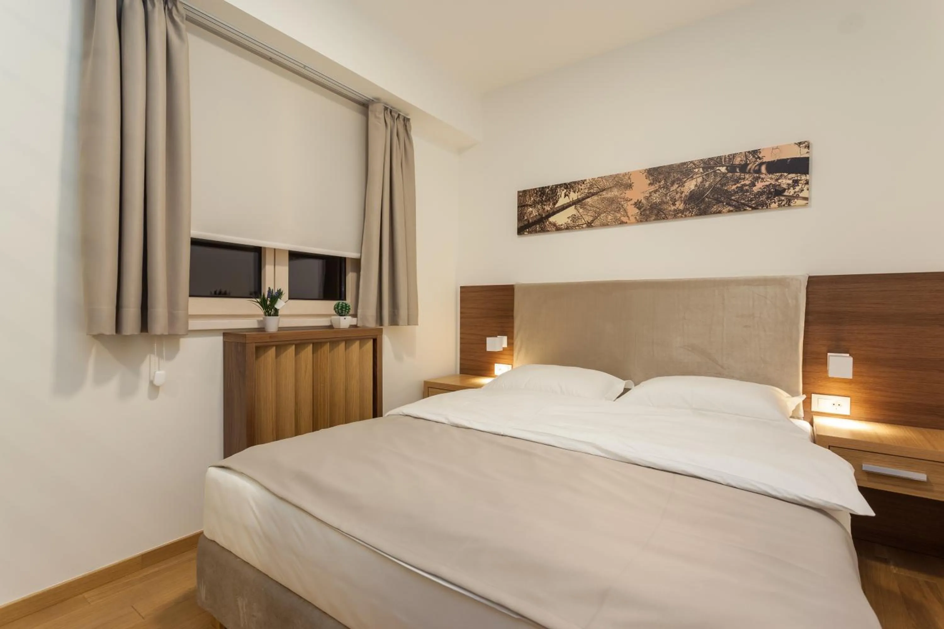 Bed in Vila Apartments Wellness&Spa