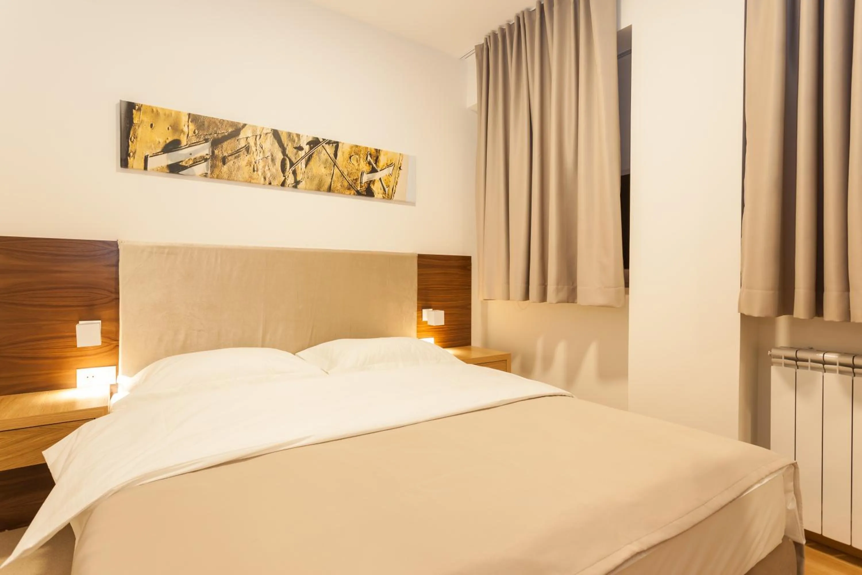 Bed in Vila Apartments Wellness&Spa