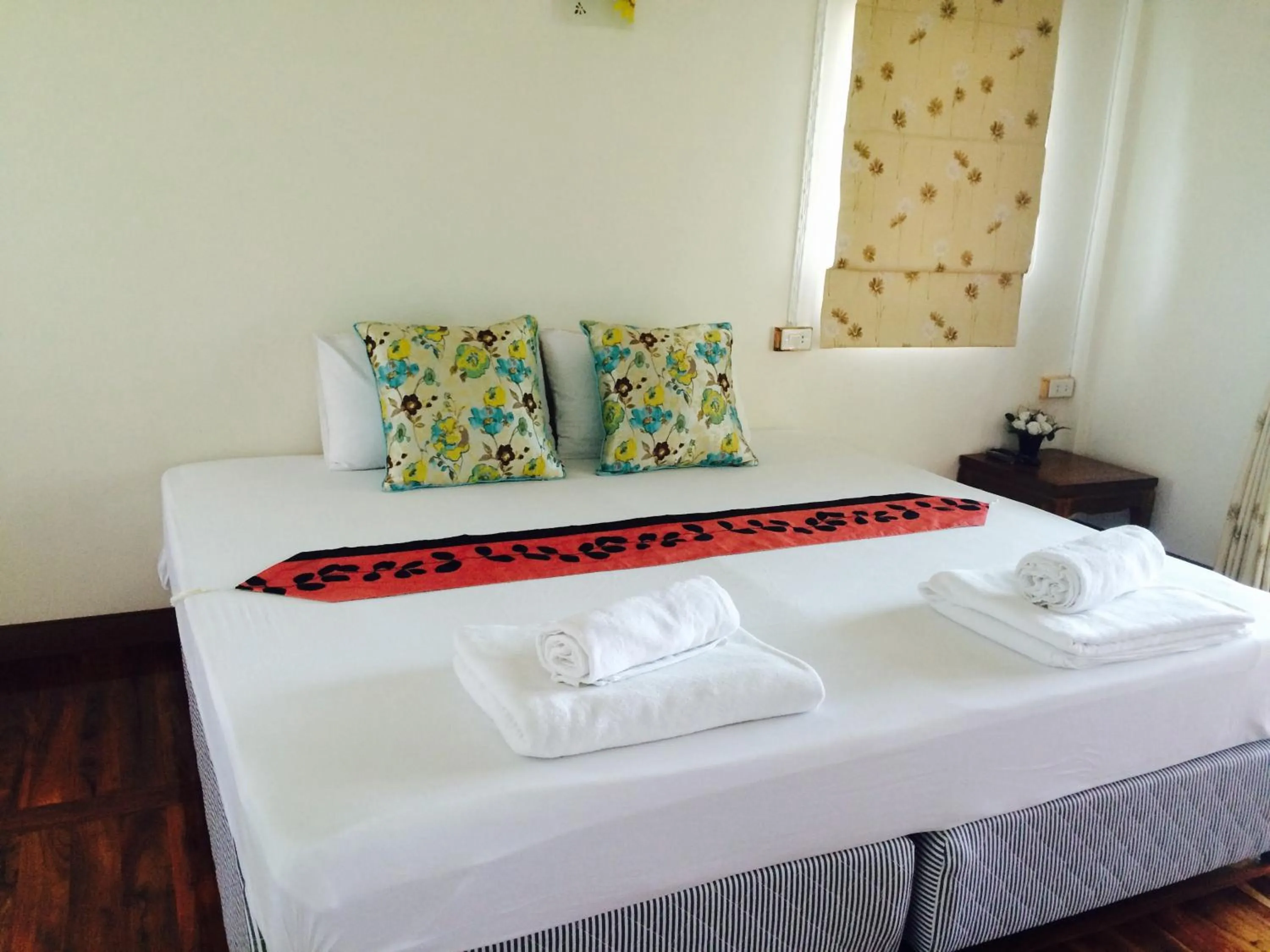 Bed in บ้านกรนรา Baan Kornnara