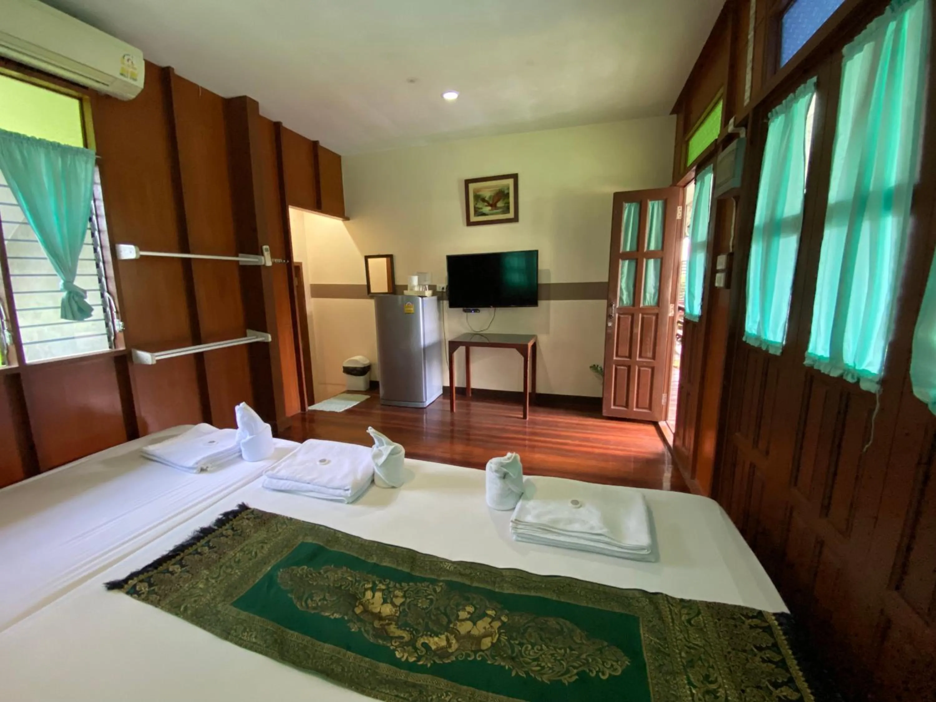 Bed in บ้านกรนรา Baan Kornnara