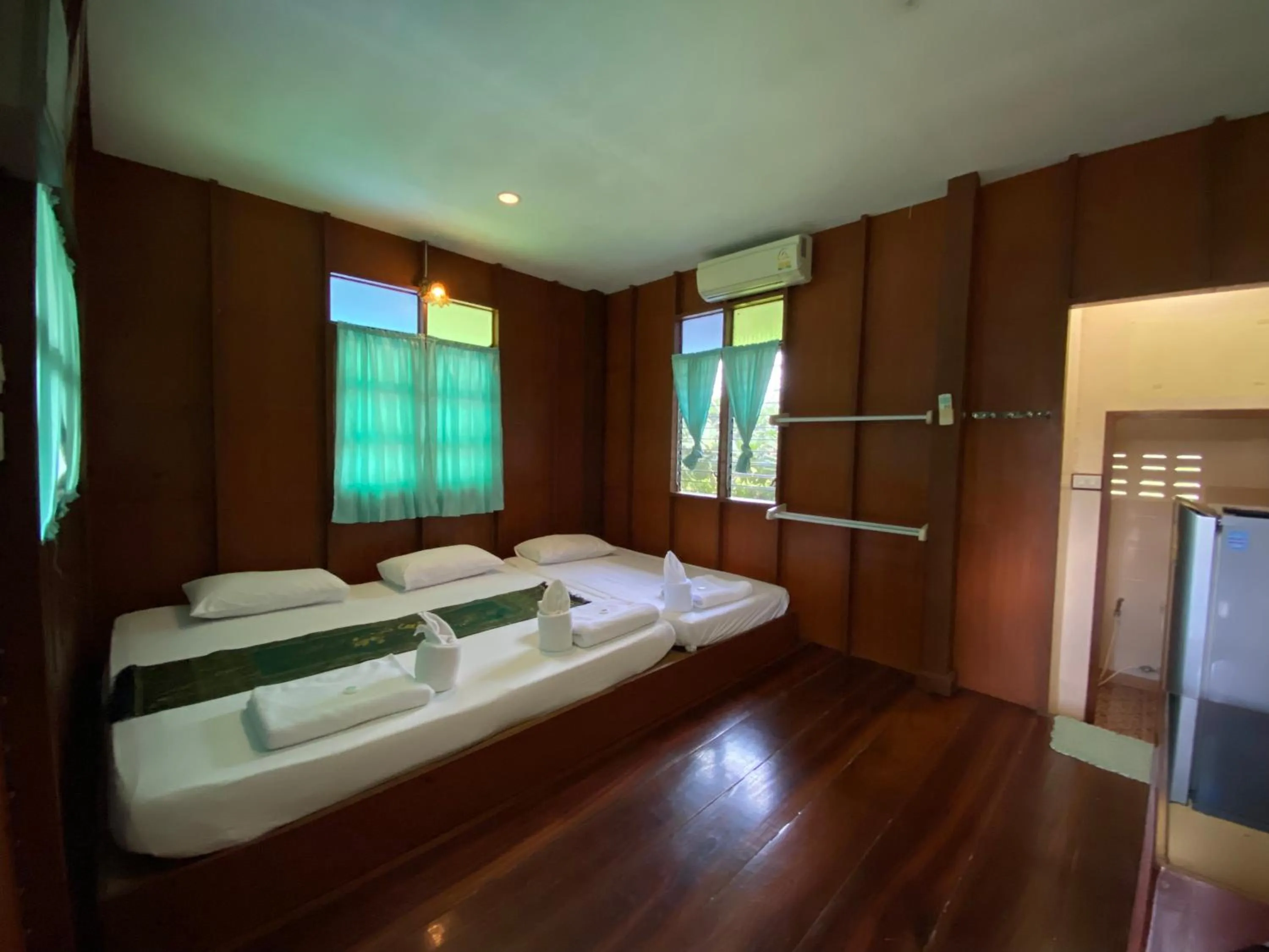 Bed in บ้านกรนรา Baan Kornnara