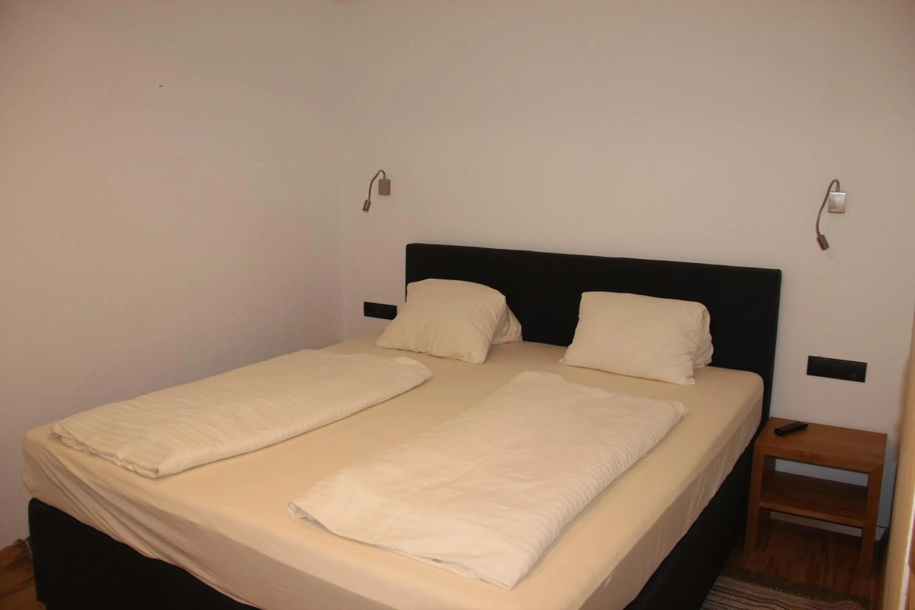 Bed in Hotel Schweizerhof