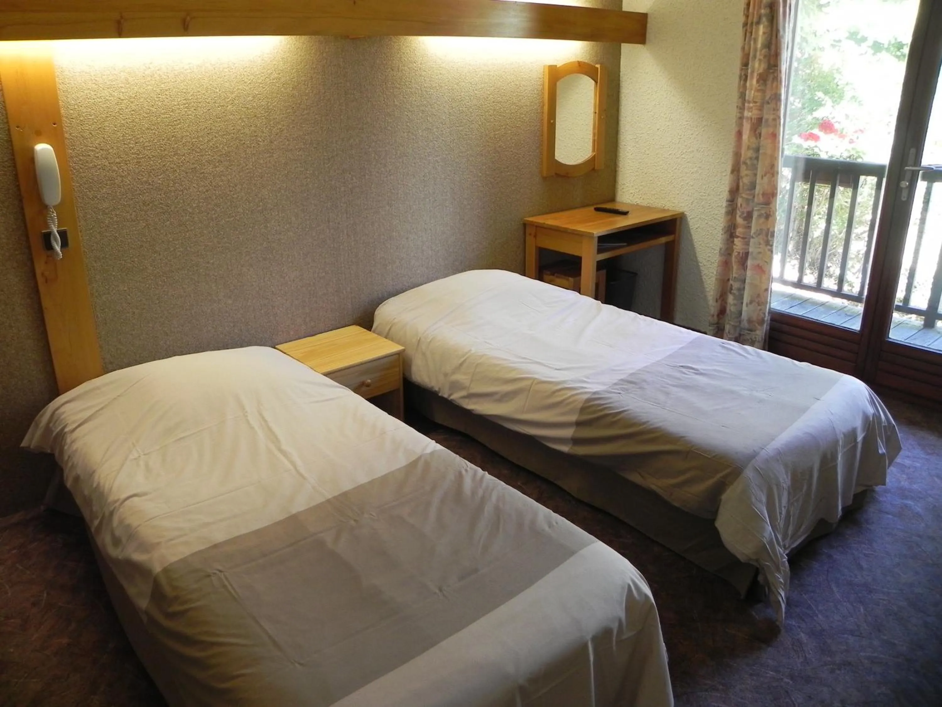 Bed in Hôtel Résidence Les Colchiques