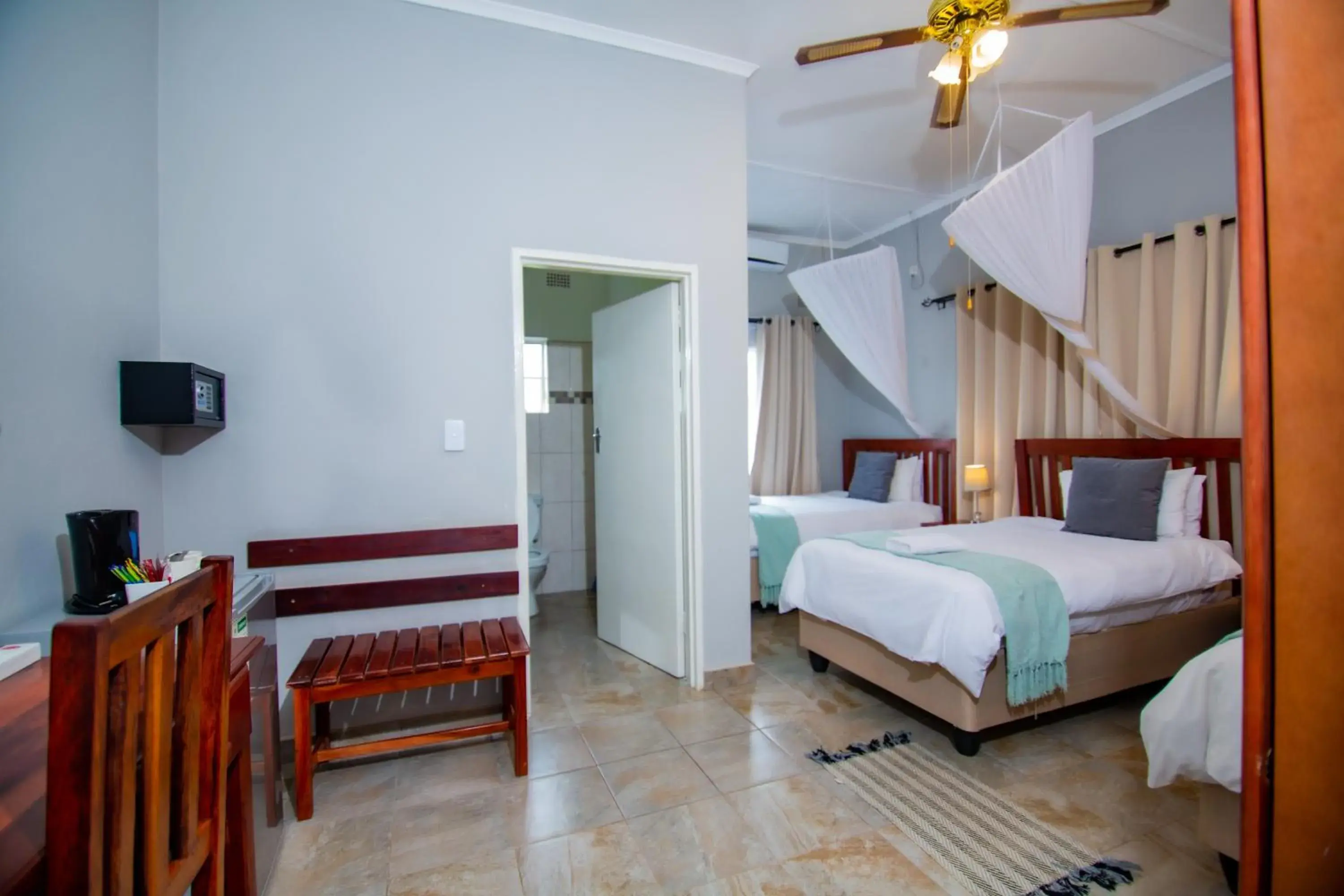 Triple Room with Private Bathroom in Dzimbahwe Guest Lodge Triple Room with Private Bathroom in Dzimbahwe Guest Lodge