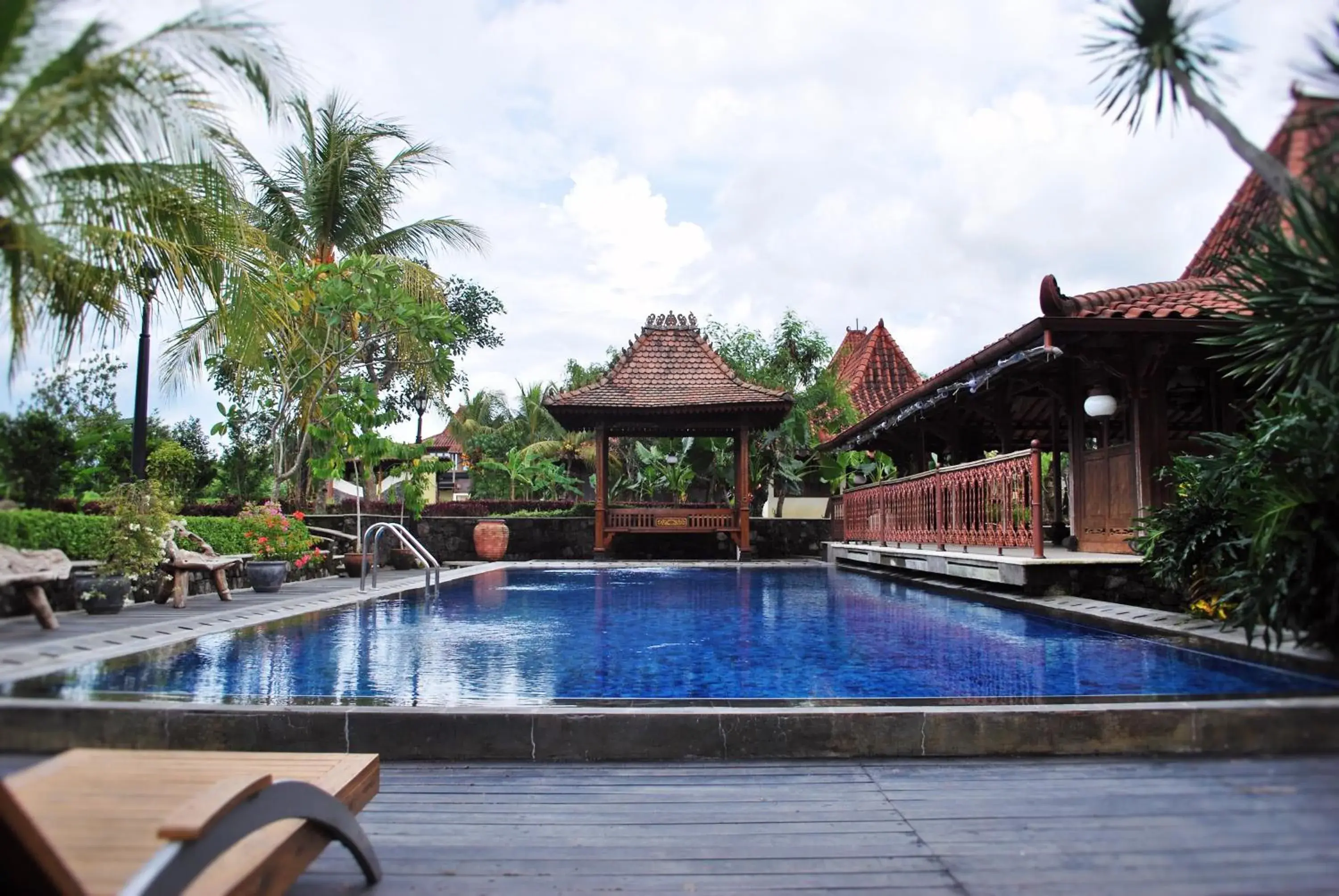Swimming pool in Java Village Resort by HOMEE Yogyakarta Swimming pool in Java Village Resort by HOMEE Yogyakarta