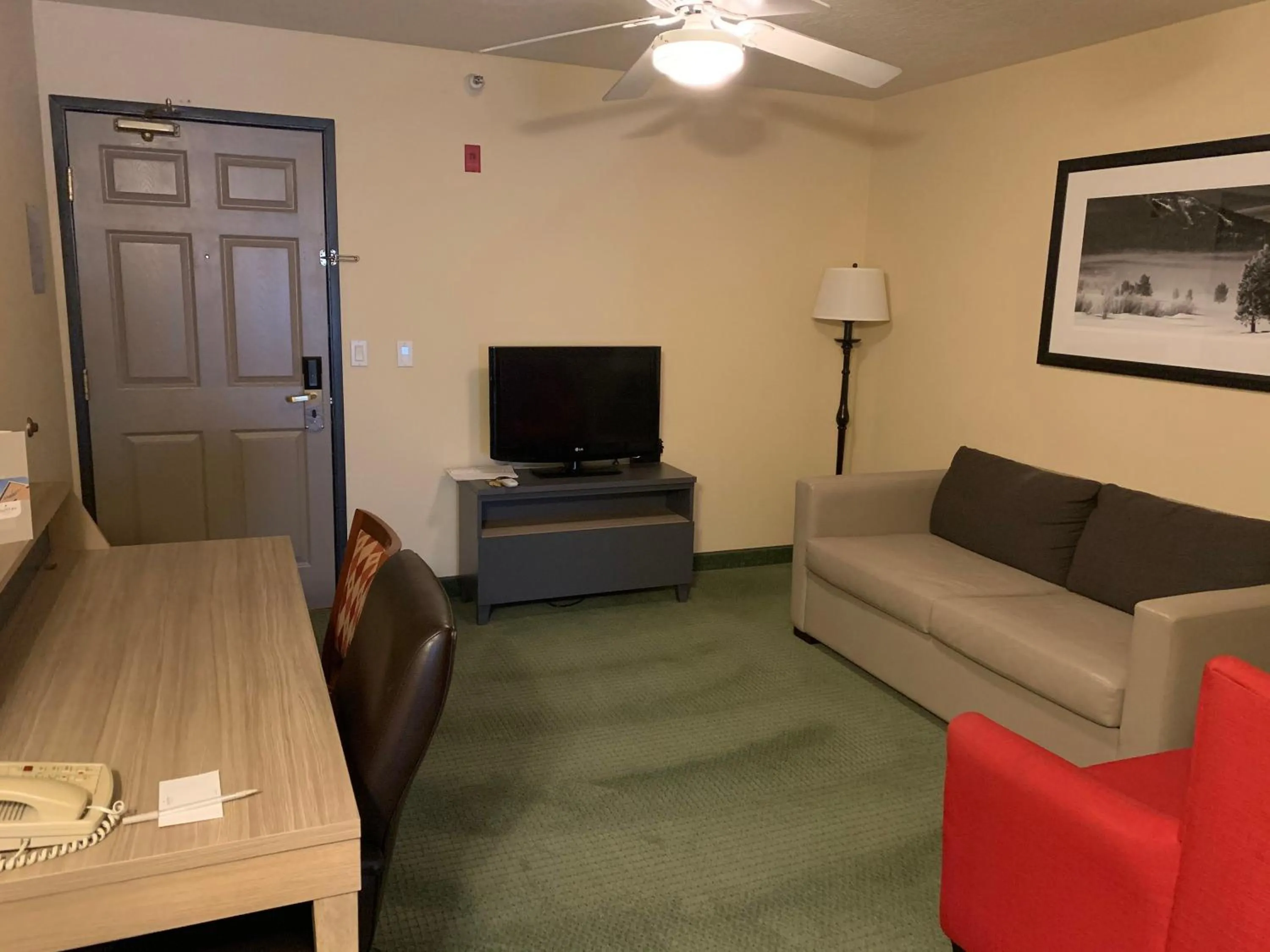 TV and multimedia in Country Inn & Suites by Radisson, West Valley City, UT