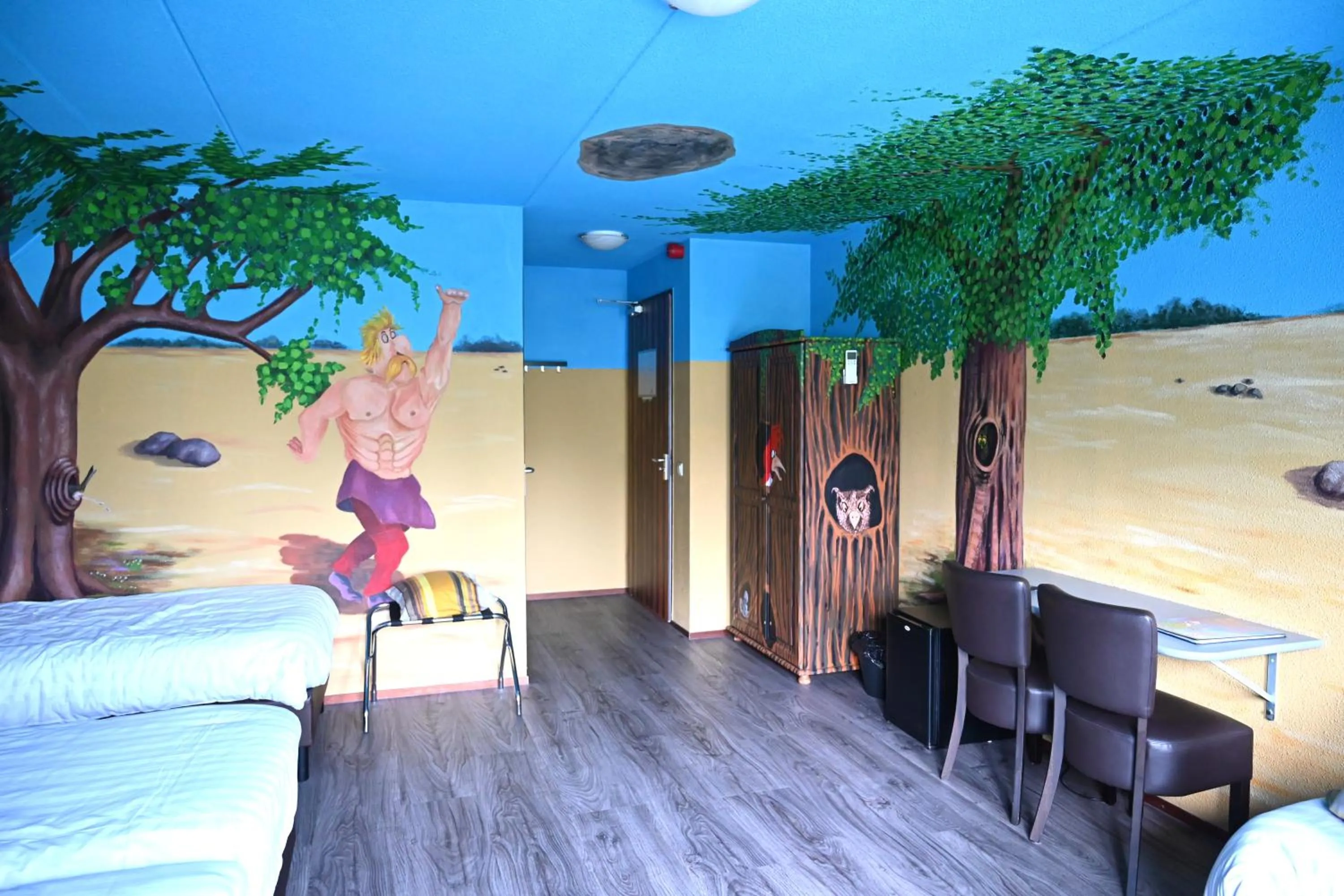 Seating area, Bed in Drouwenerzand Hotel