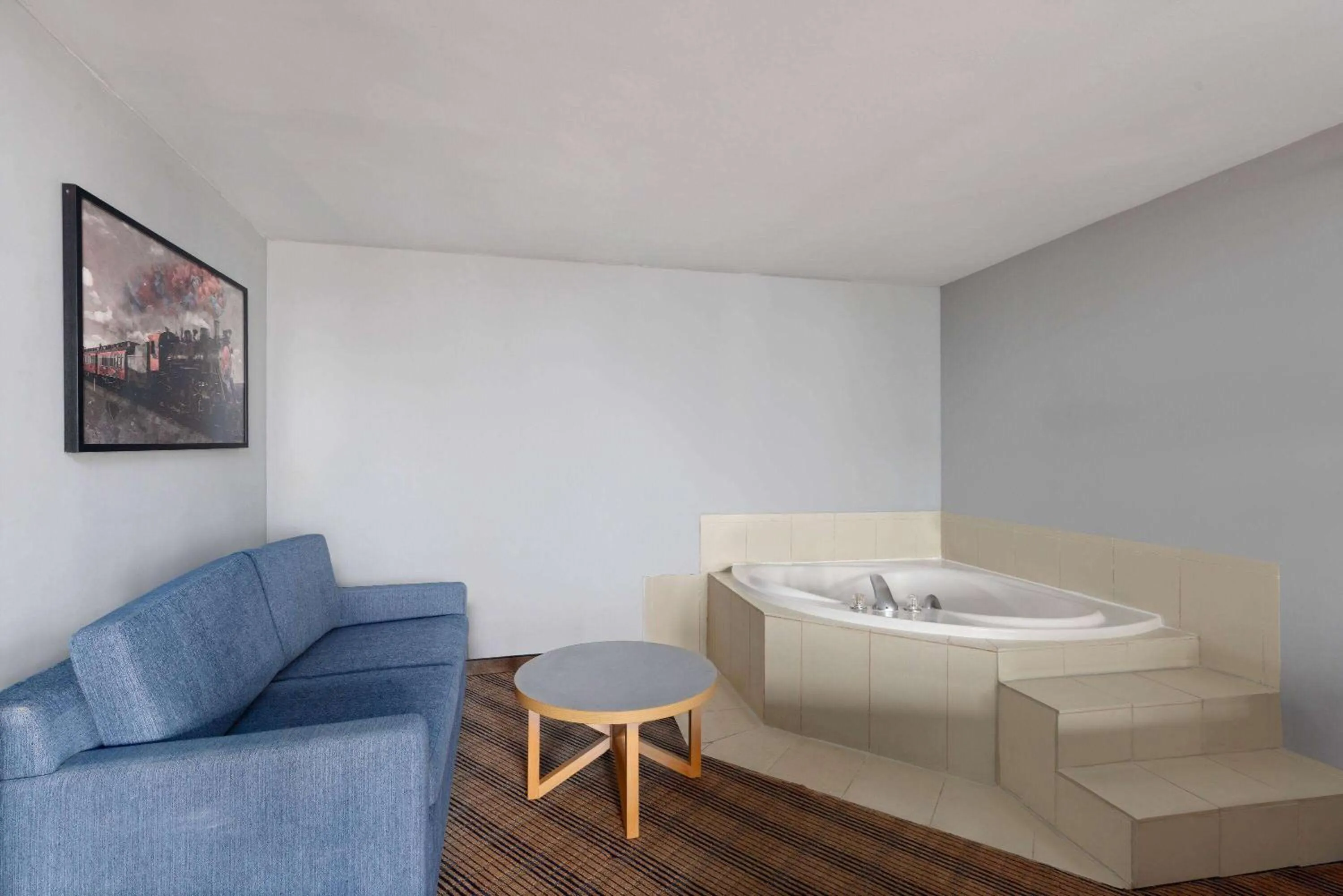 Bath in AmericInn by Wyndham Omaha Near Zoo